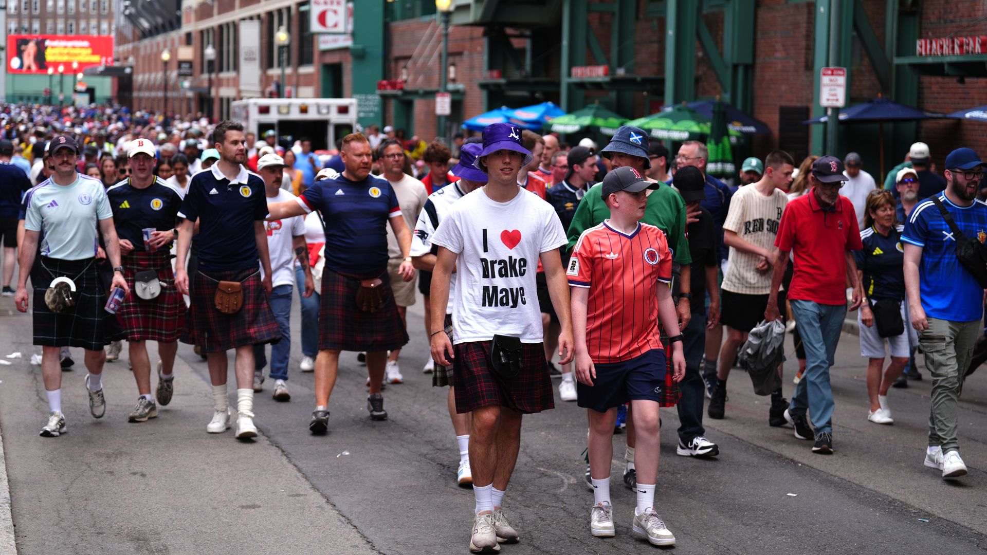 Scotland soccer fans wearing kilts, Scotland jerseys and tartan accessories gather in Boston before Scotland’s World Cup Group C match against Morocco.