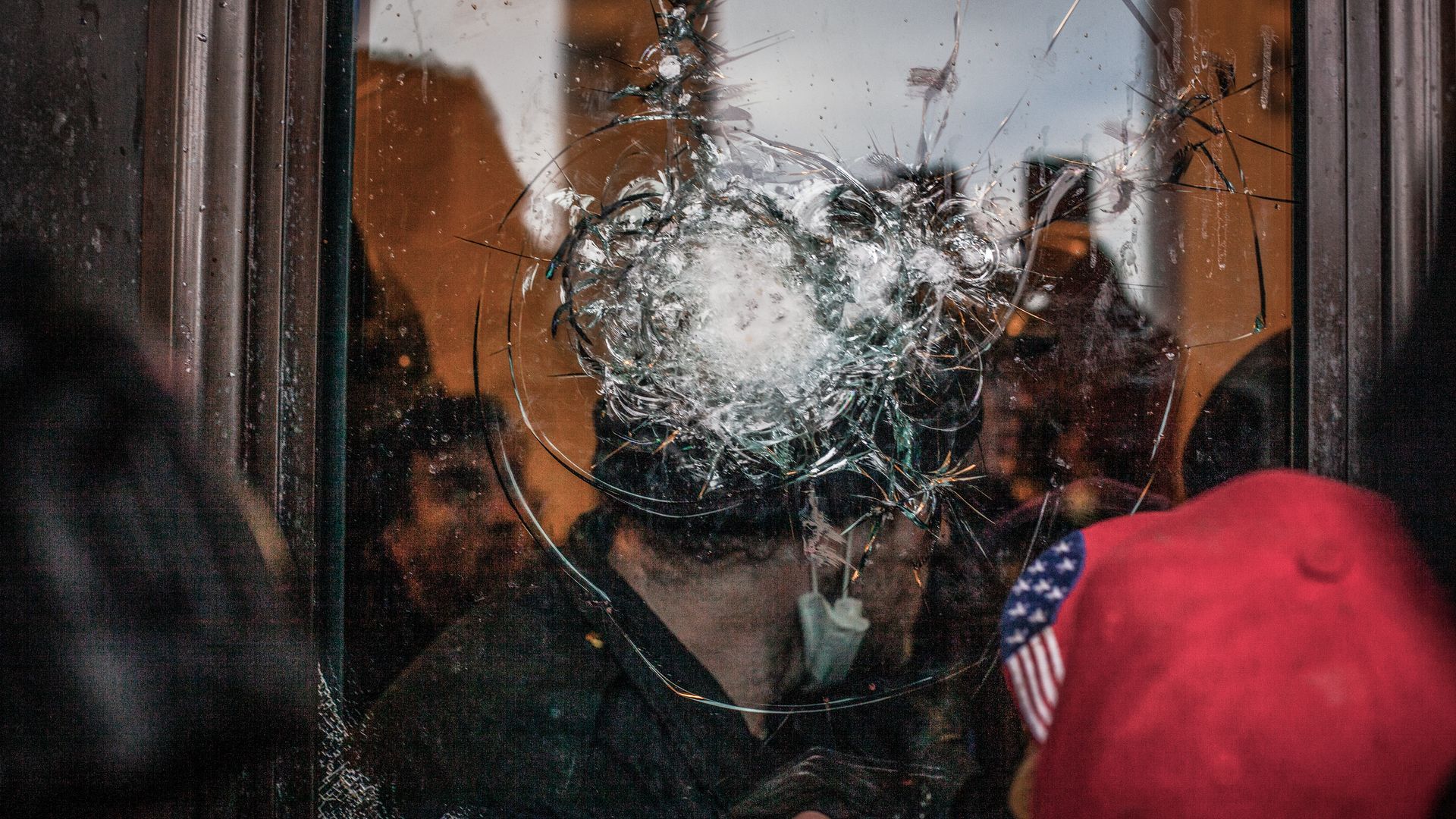 Picture of a shattered glass door in the Capitol
