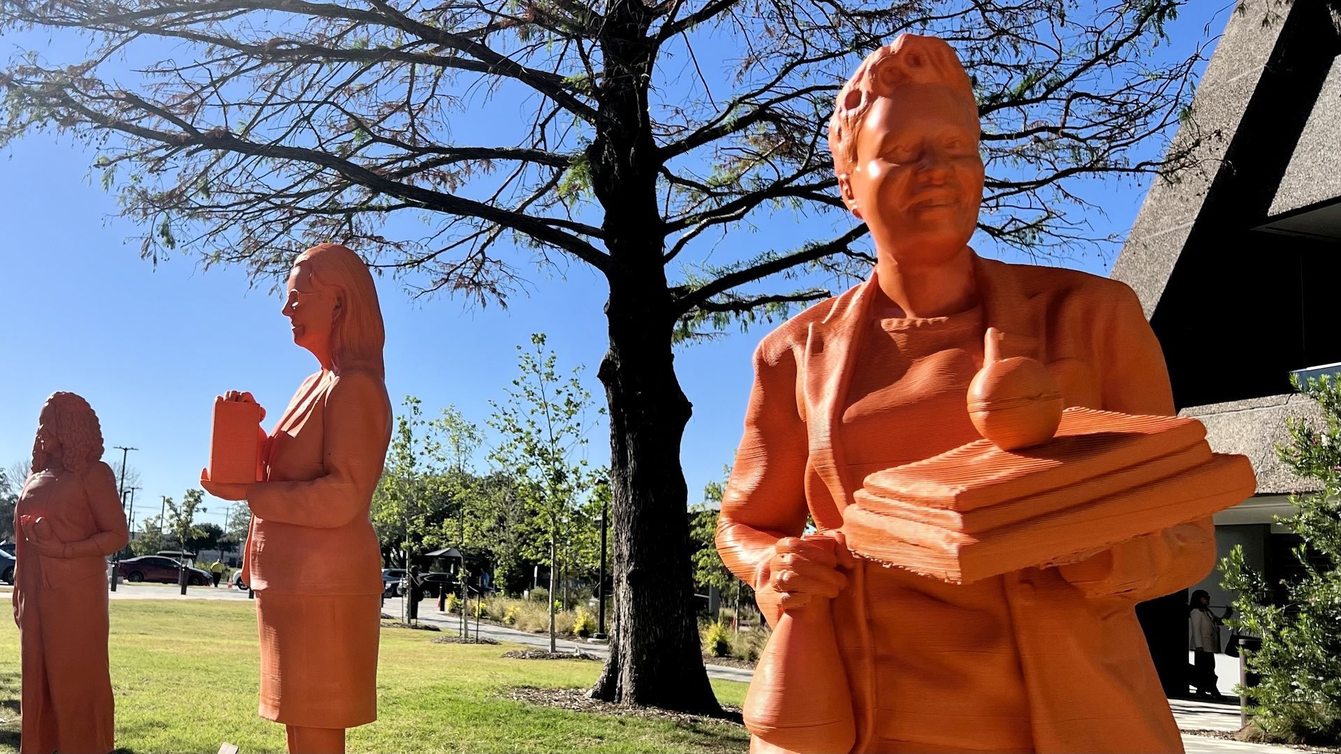 Orange 3D renderings of women 