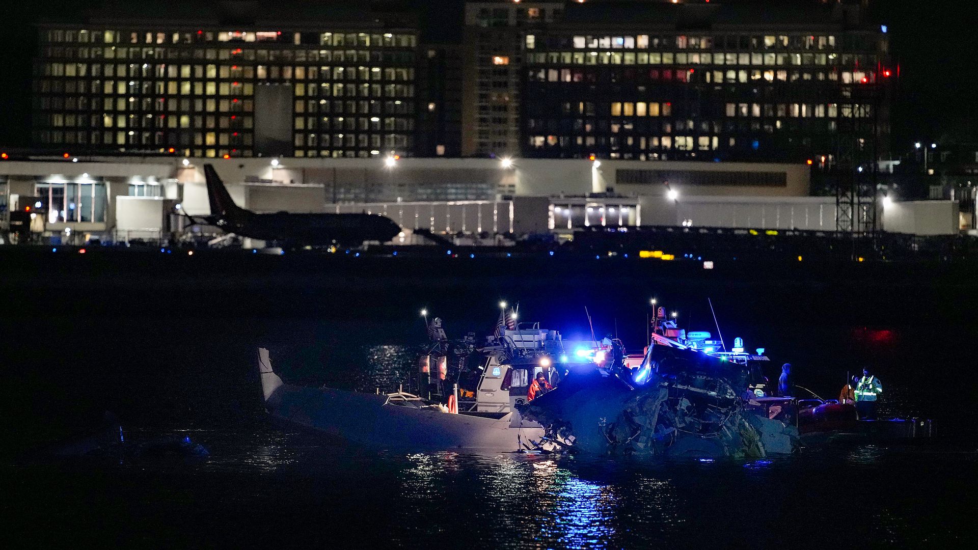  Emergency response units assess airplane wreckage in the Potomac River near Ronald Reagan Washington Airport on January 30, 2025 in Arlington, Virginia. An American Airlines flight from Wichita, Kansas collided with a helicopter while approaching Ronald Reagan National Airport.