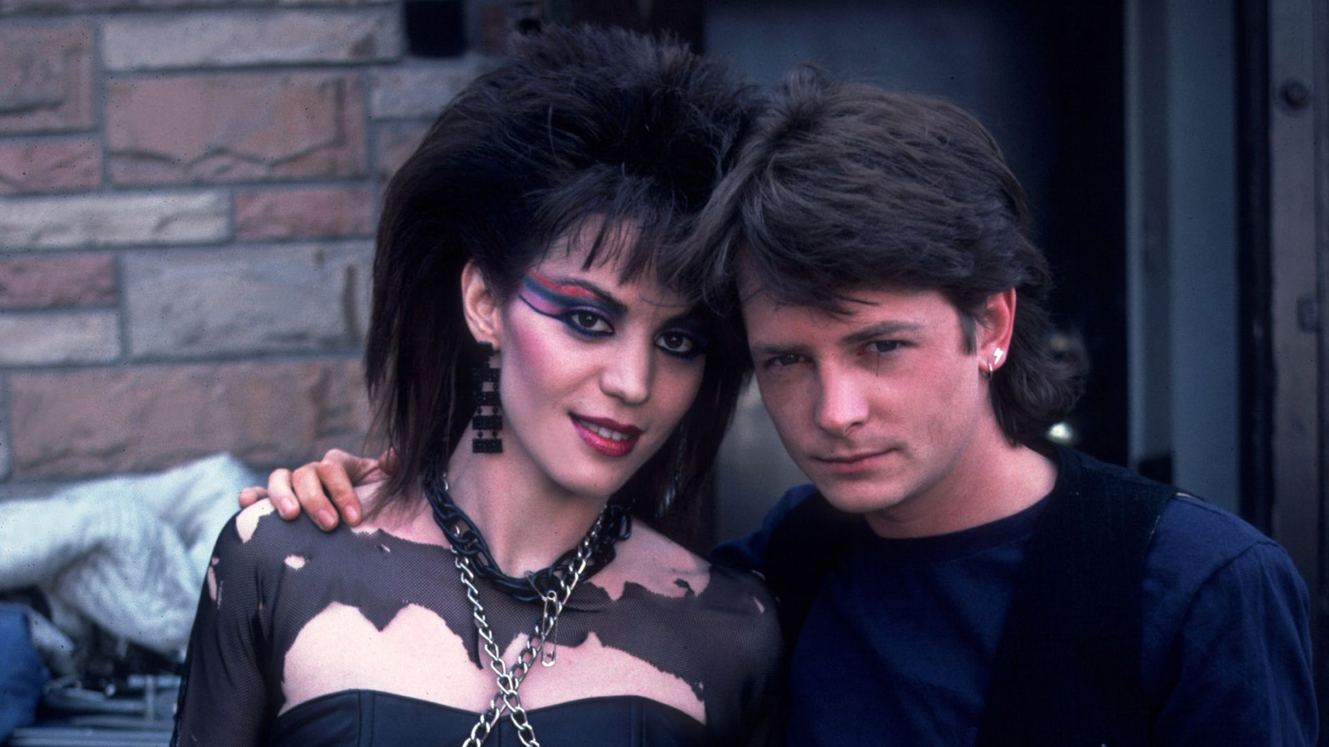 Joan Jett and Michael J. Fox pose for a photo in the 1980s.