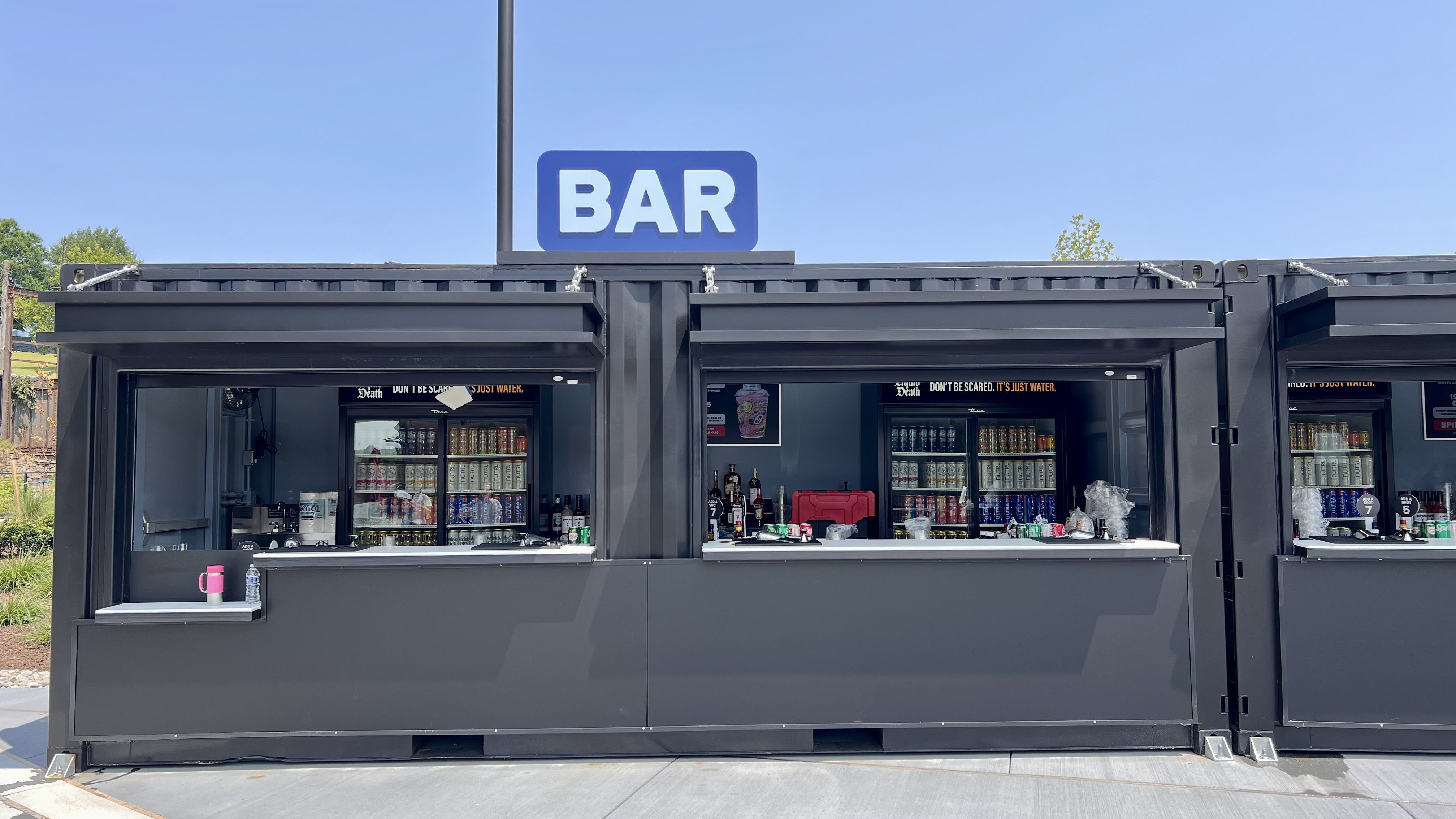 a food truck style bar that says "bar" in all caps on the top