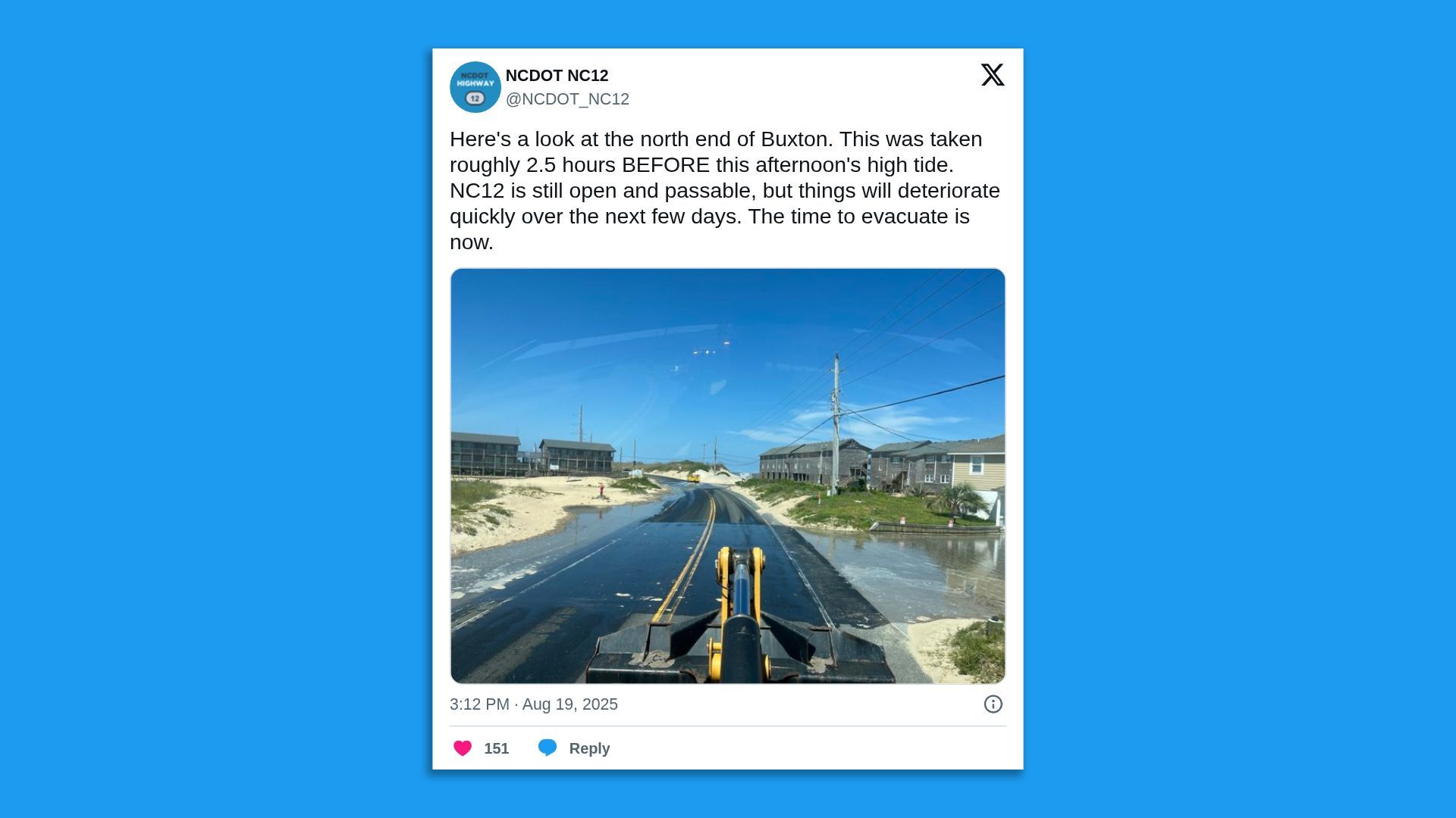 A screenshot of an NC DOT tweet showing a flooded road, saying: " Here's a look at the north end of Buxton. This was taken roughly 2.5 hours BEFORE this afternoon's high tide. NC12 is still open and passable, but things will deteriorate quickly over the next few days. The time to evacuate is now."