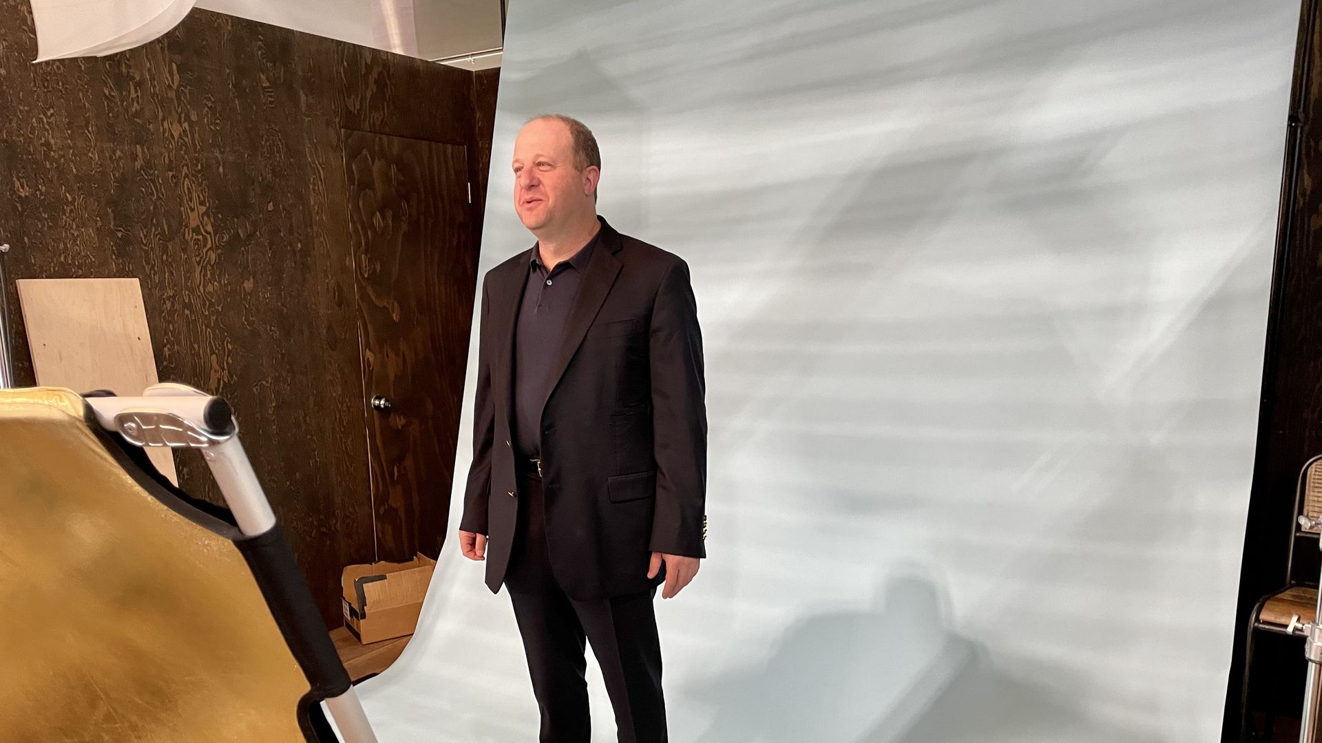 Gov. Jared Polis poses for a photo at the 2021 Outdoor Retailer show in Denver. Photo: John Frank/Axios