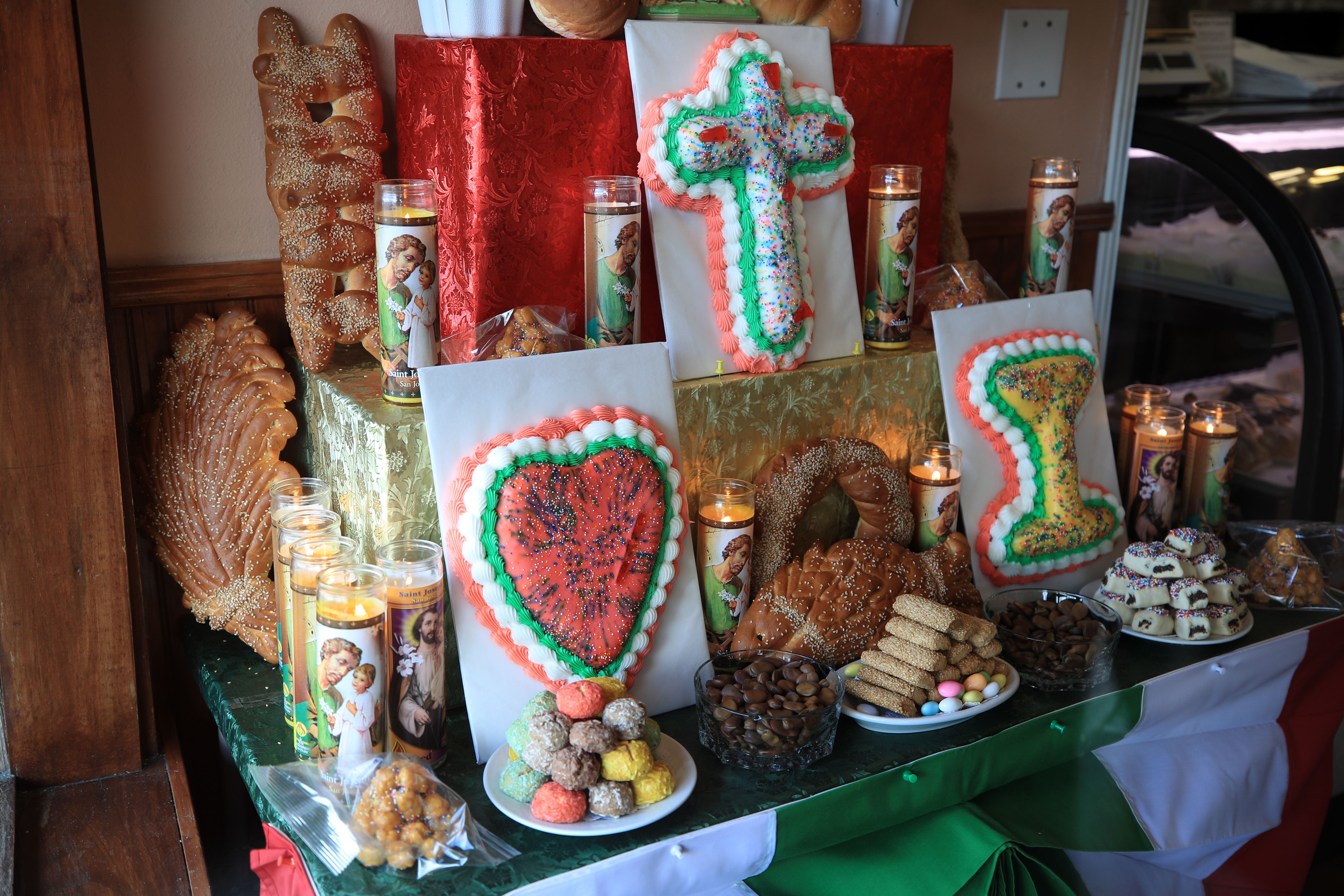 Photo shows a St. Joseph's Day altar with bread and other food.