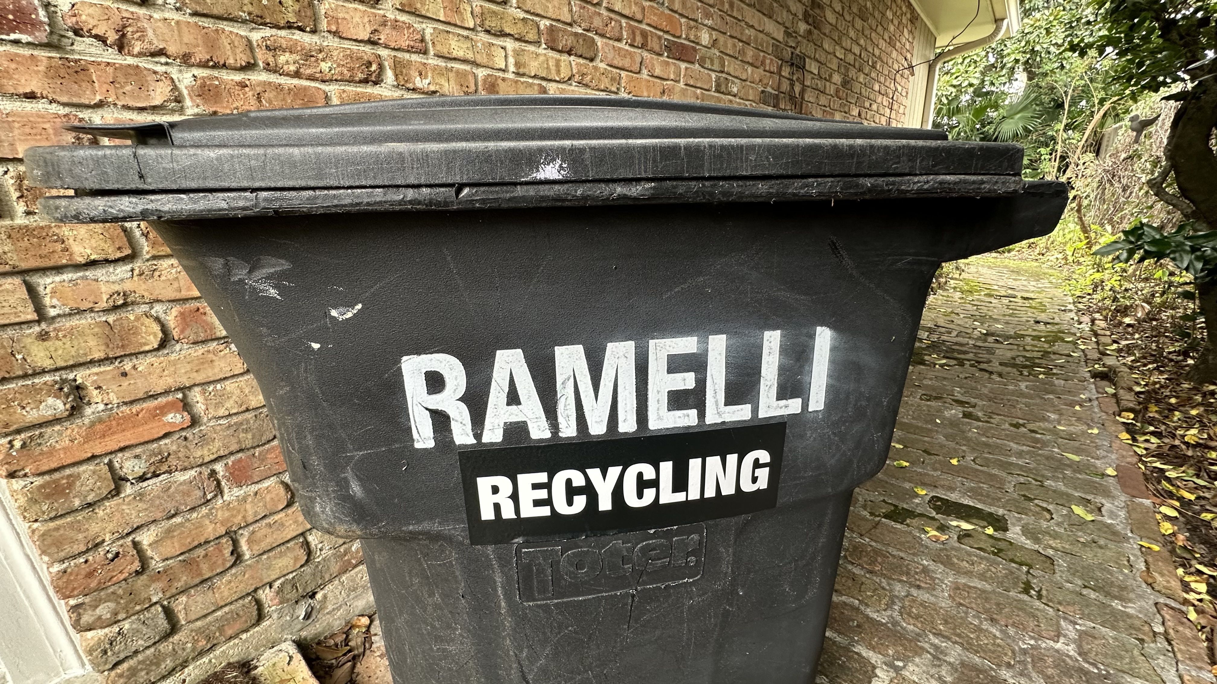Photo shows a black recycling bin that says "Ramelli Recycling."