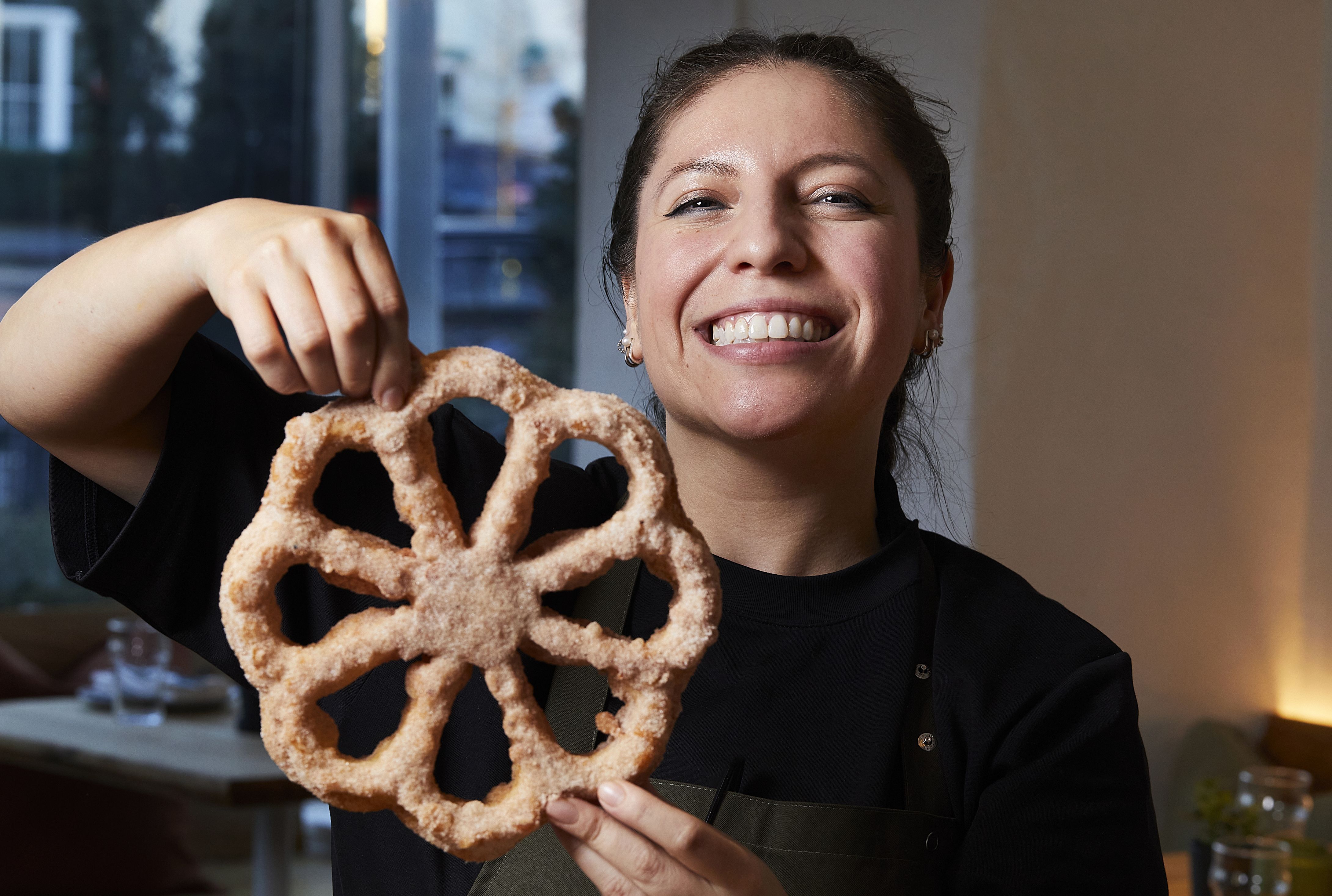 Isabel Coss holds a Mexican pinwheel pastry 