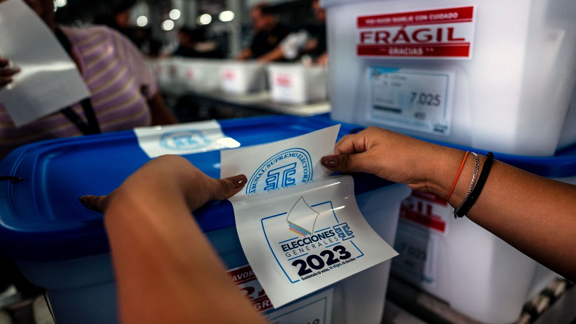 Electoral officials finalize the prep of ballot boxes for Guatemala's presidential runoff, Aug. 15. Photo: Luis Acosta/AFP via Getty Images