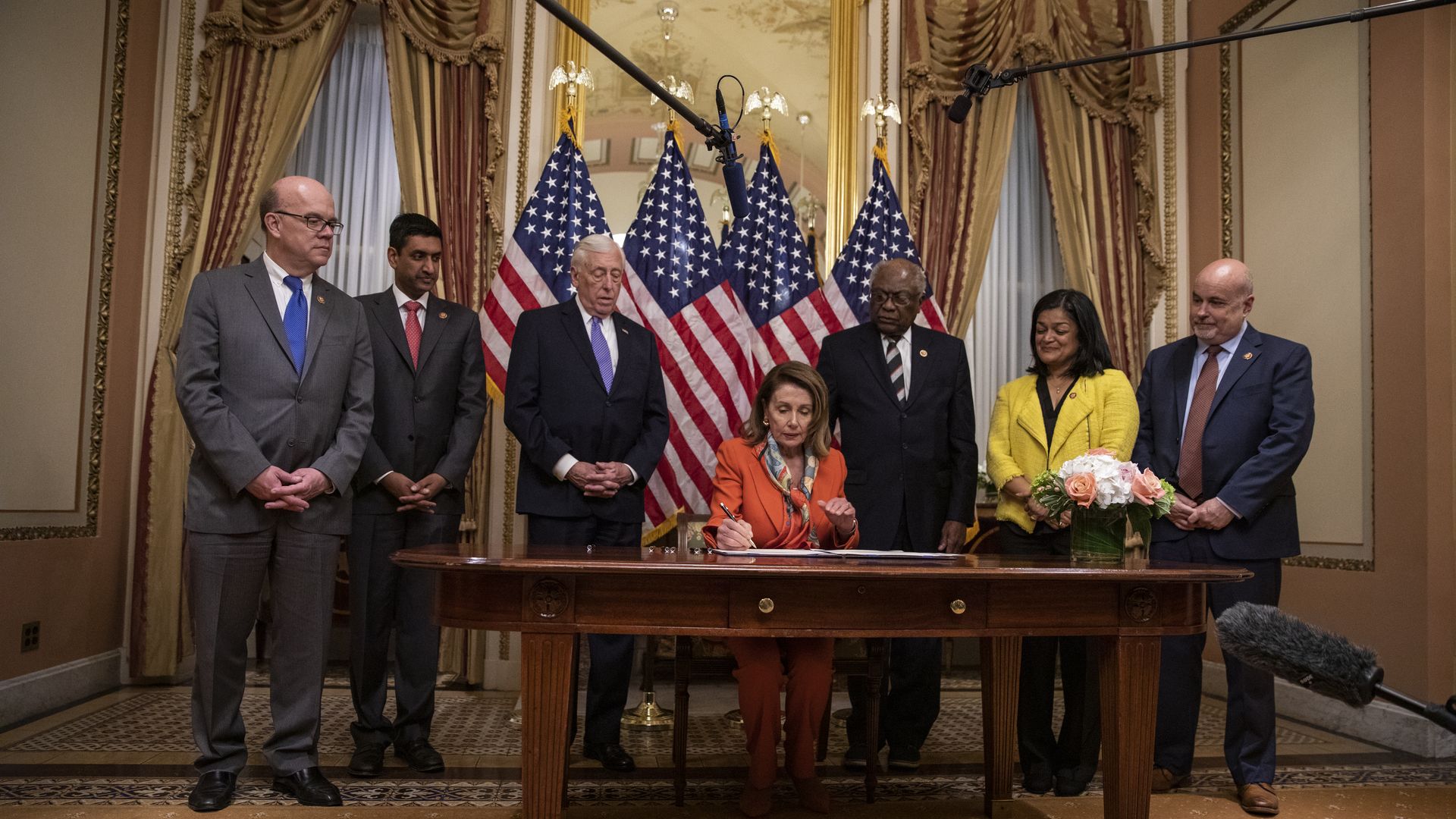 Nancy Pelosi participates in a bill enrollment ceremony for legislation ending U.S. involvement in the war in Yemen