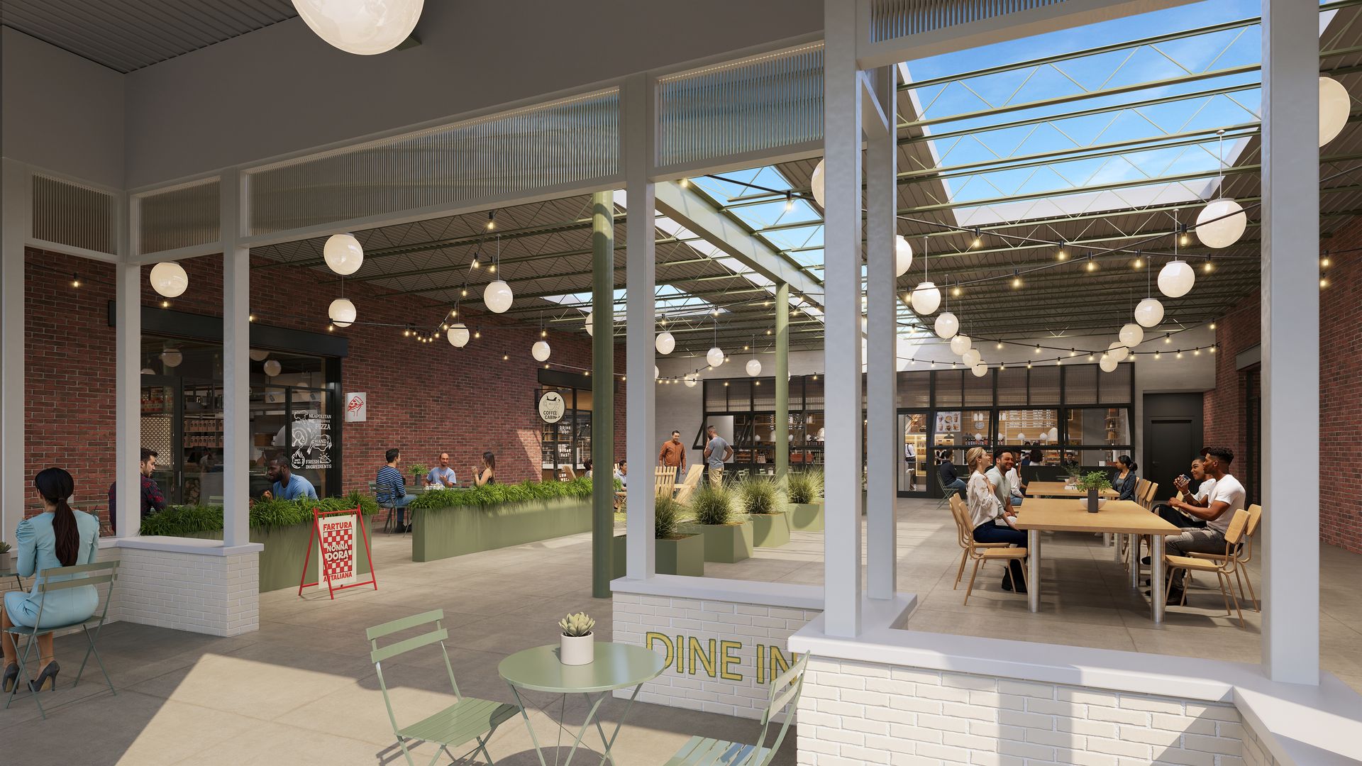 Indoor dining area with a glass roof, hanging globe lights, people sitting at tables, red brick walls, and green plants in planters, creating a cozy atmosphere.