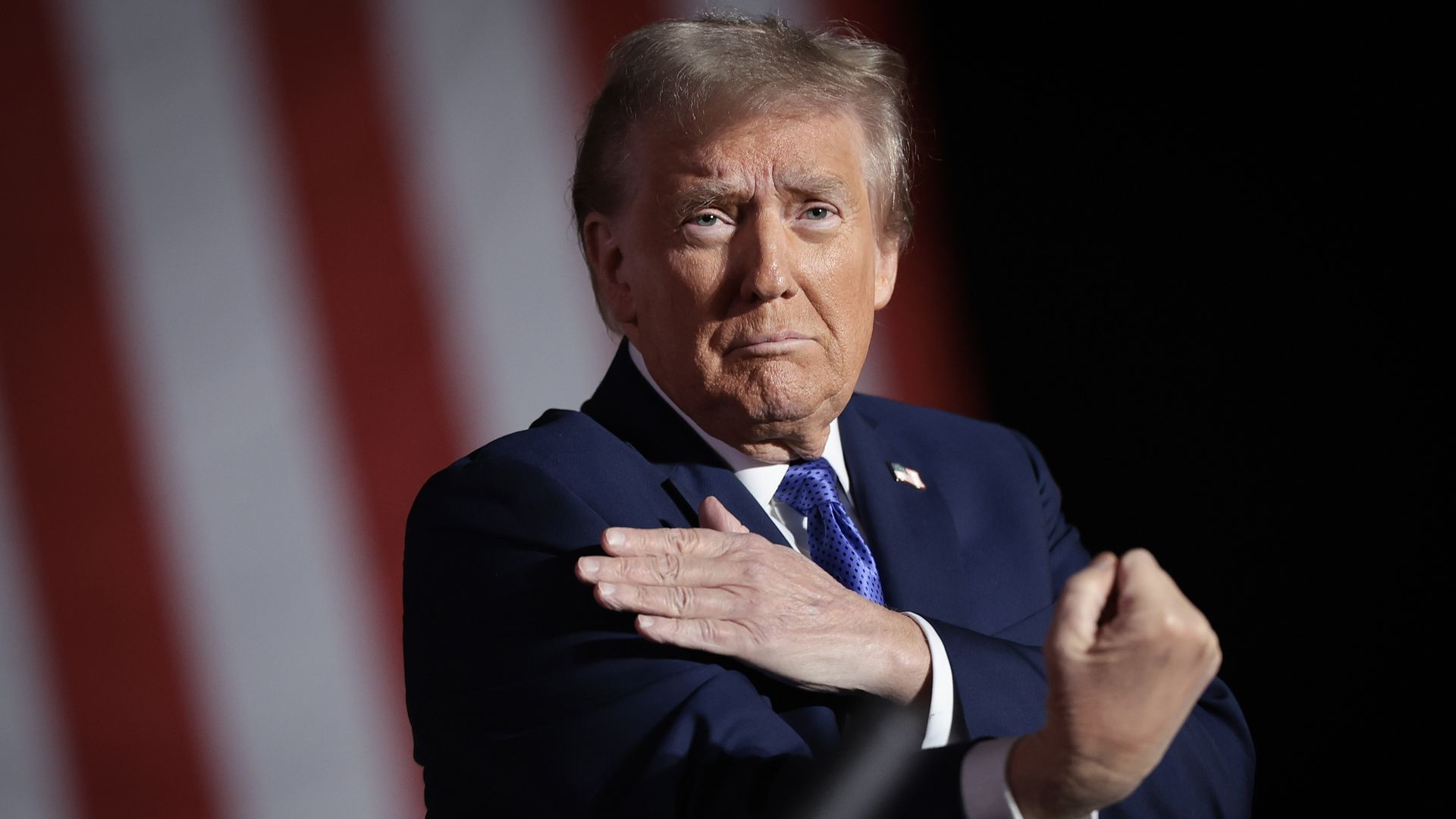 Trump gestures to the crowd at an October campaign rally.