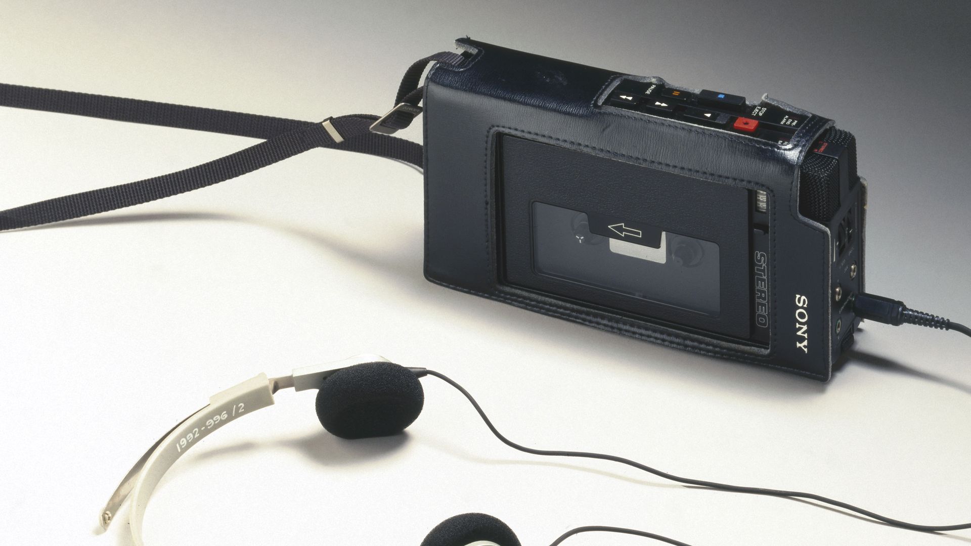 an original Walkman device and headphones