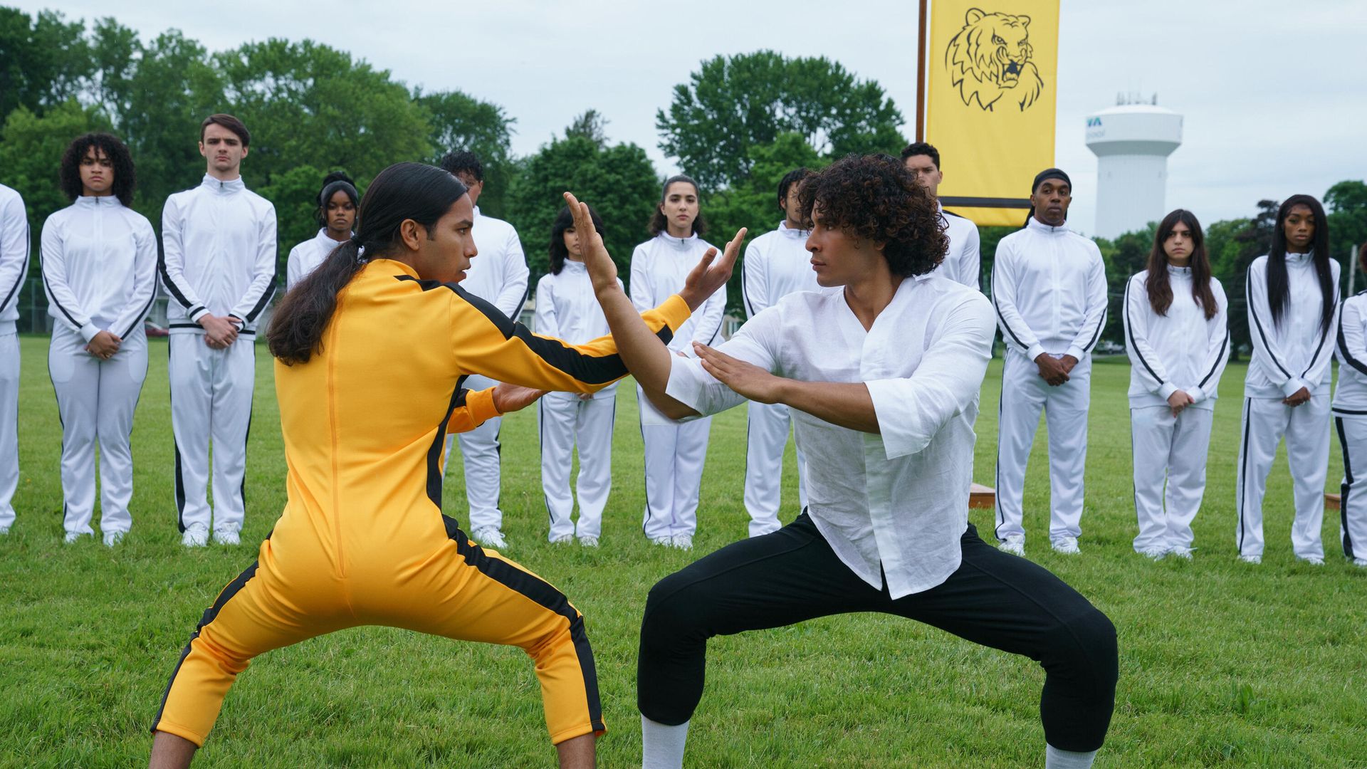 "Miguel" (left) and "Adrian" (right) in a martial arts fighting stance in a still from the movie "Miguel Wants To Fight"