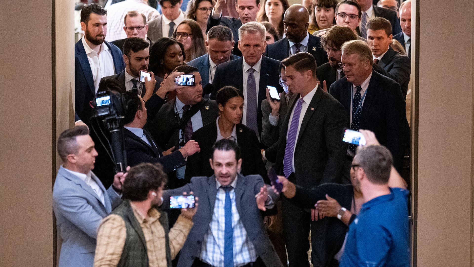 Former House Speaker Kevin McCarthy and a throng of reporters.