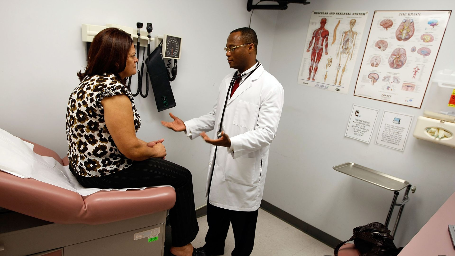 Doctor discussing health issues with patient in community health center