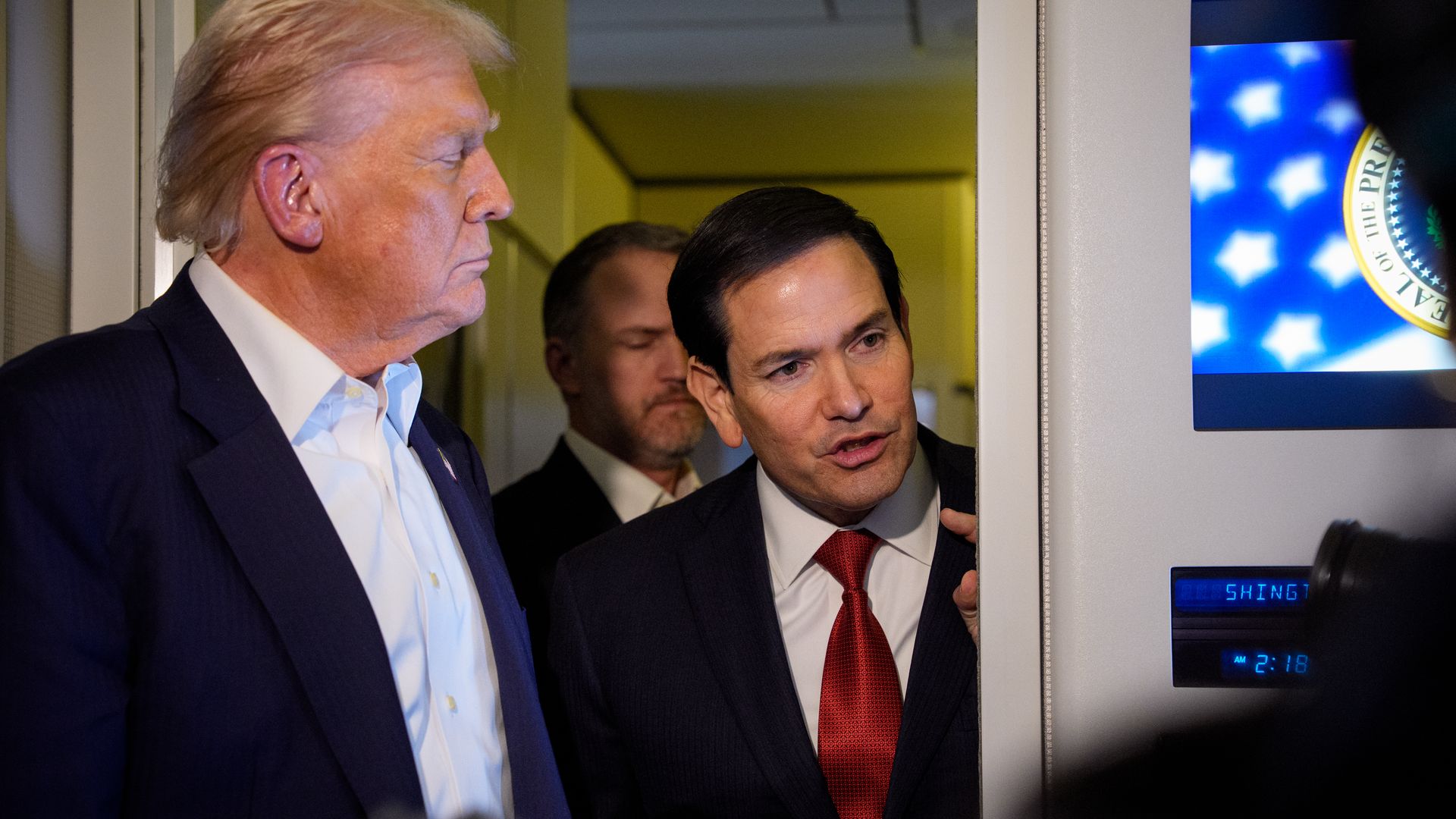 Secretary of State Marco Rubio, accompanied by President Donald Trump, speaks to members of the media aboard Air Force One 