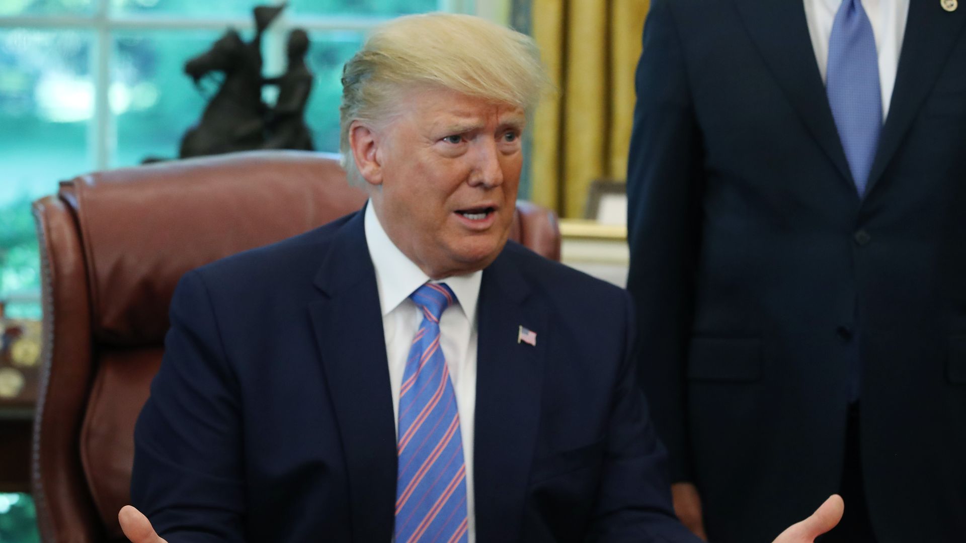 Trump in his seat in the Oval Office. 