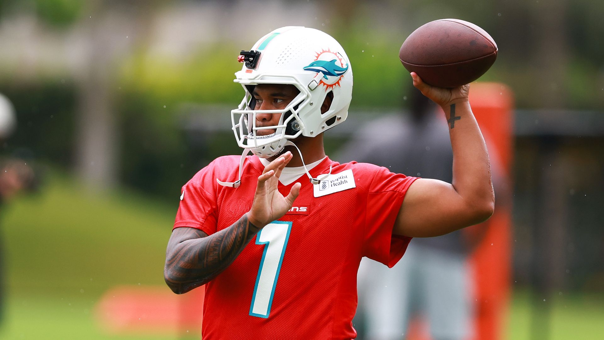 Miami Dolphins quarterback Tua Tagovailoa throws the ball during training camp.