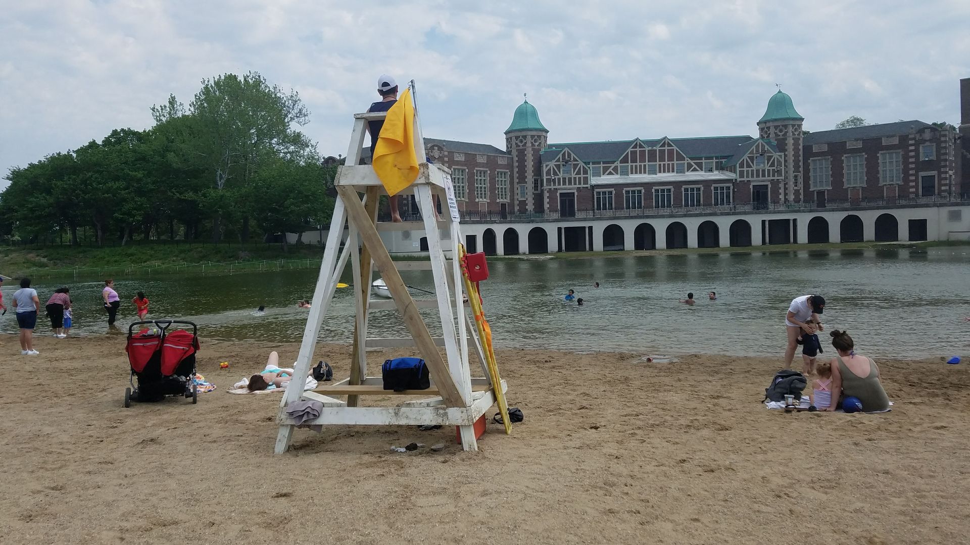 A lifeguard sits on an elevated chair on Humboldt Park Beach