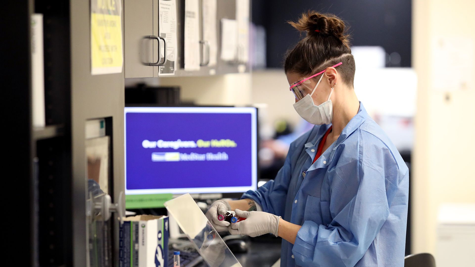 Technicians in the testing lab wear personal protective equipment while processing bloodwork at MedStar St. Mary's Hospital April 8, 2020 in Leonardtown, Maryland. 