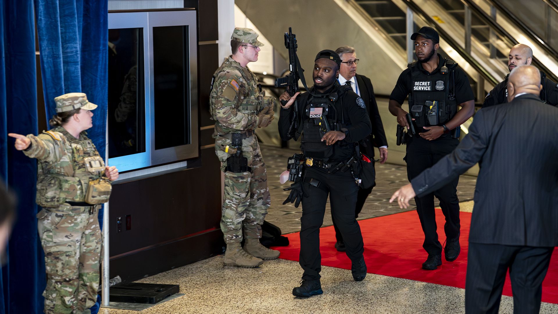 Members of the National Guard and Secret Service respond after shots were fired during the Whit House Correspondents’ Dinner at the Washington Hilton on April 25 in Washington, D.C. 