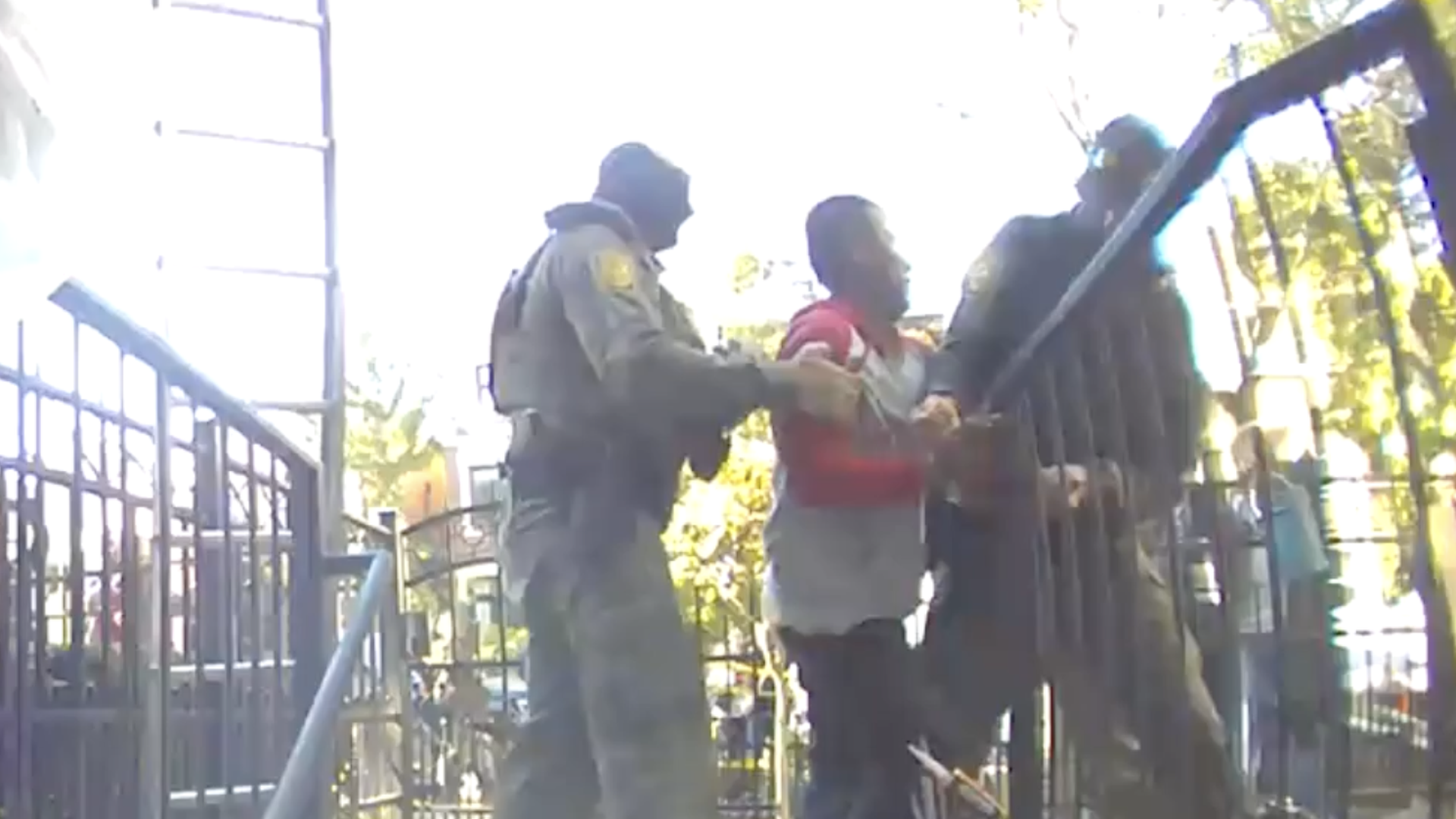 Man being apprehended by federal agents 