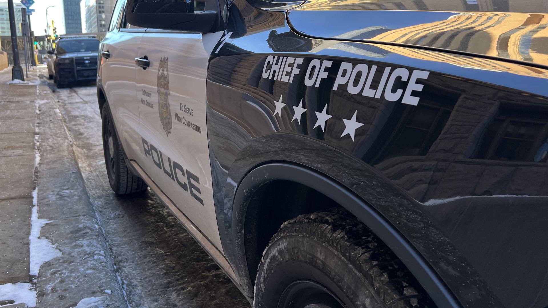 A close up of a squad car parked on a curb in Minneapolis