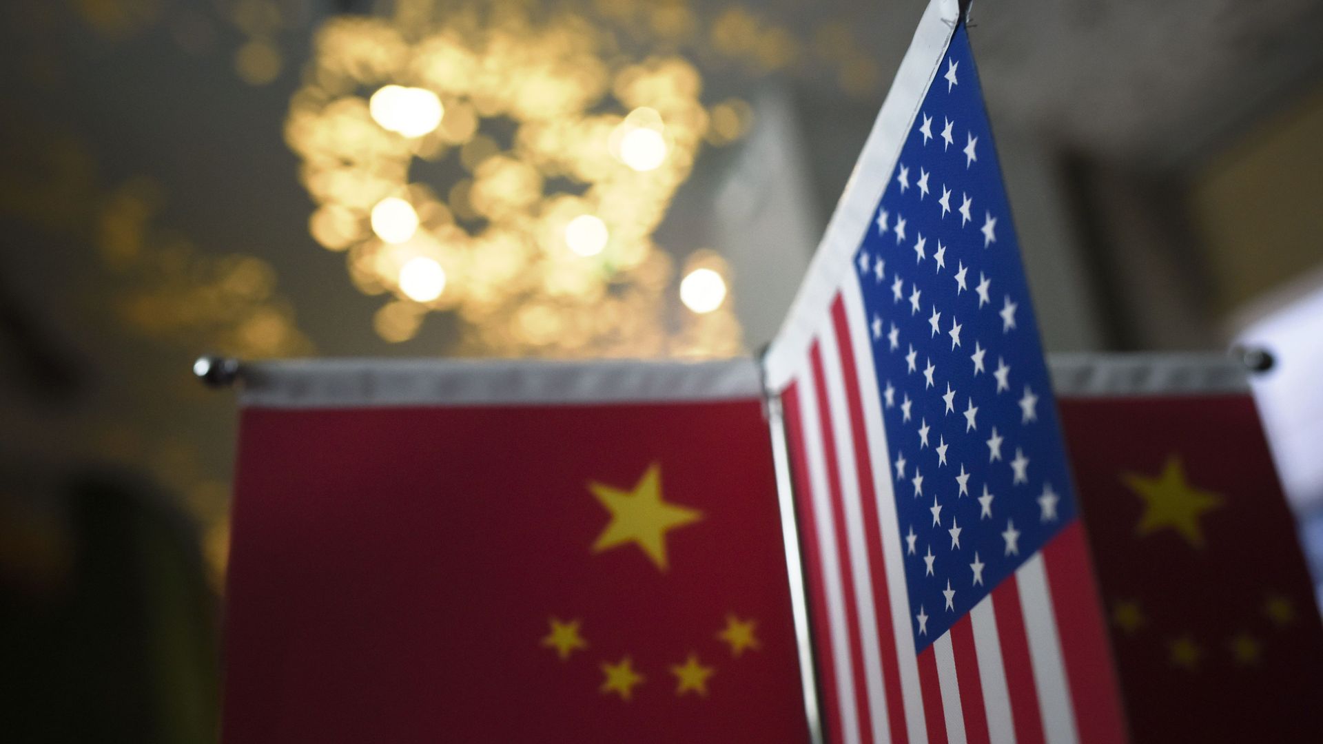 Chinese flags and American flags are displayed in a company in Beijing on August 16, 2017