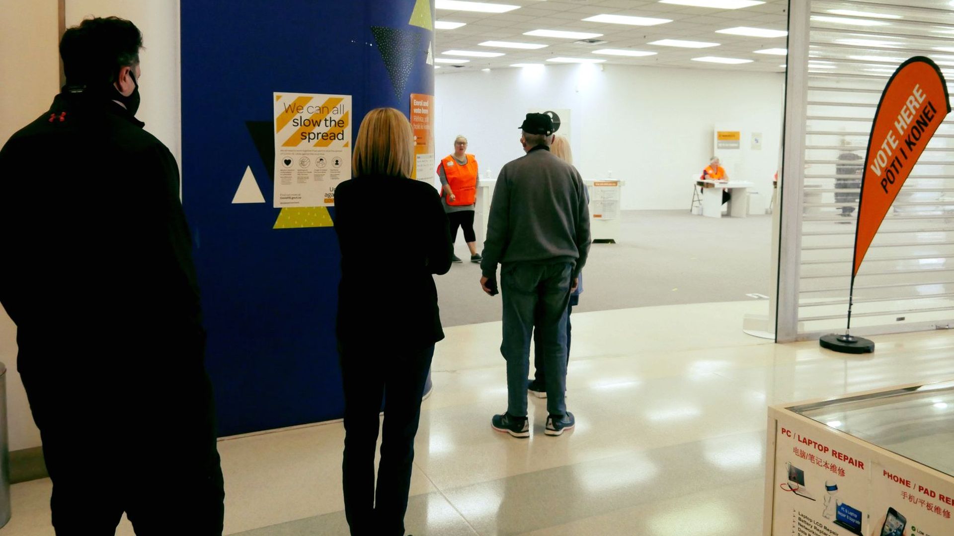 People line up to vote at Highbury Shopping Center in Auckland
