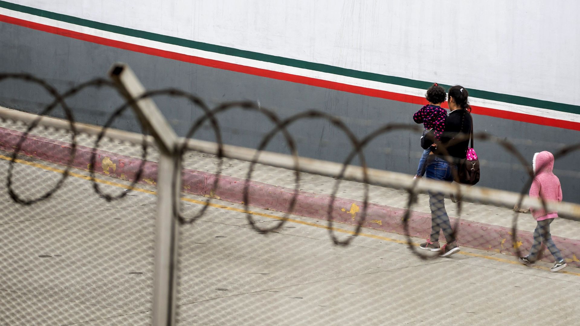 A woman holds a child 