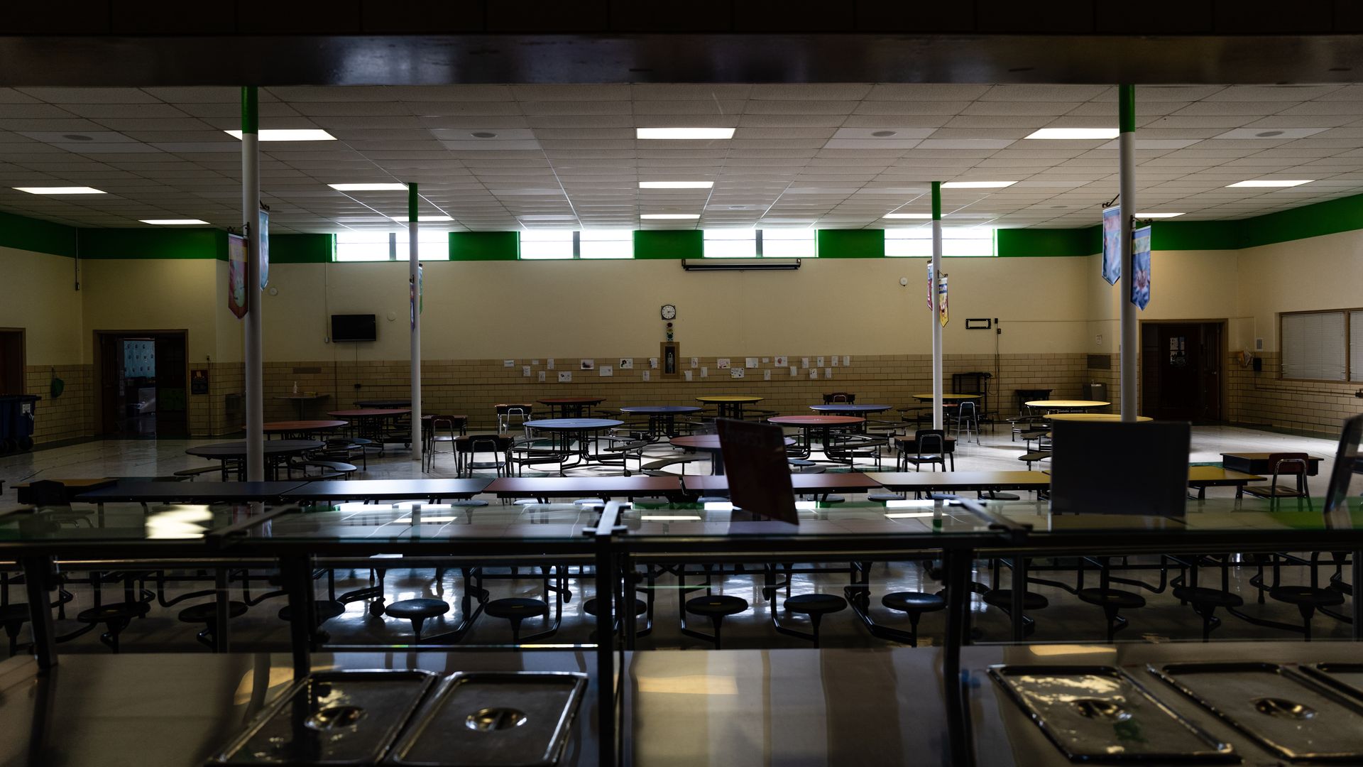 Unused lunch tables are seen in an empty cafeteria during a period of Non-Traditional Instruction (NTI) at Hazelwood Elementary School on January 11, 2022 in Louisville, Kentucky.