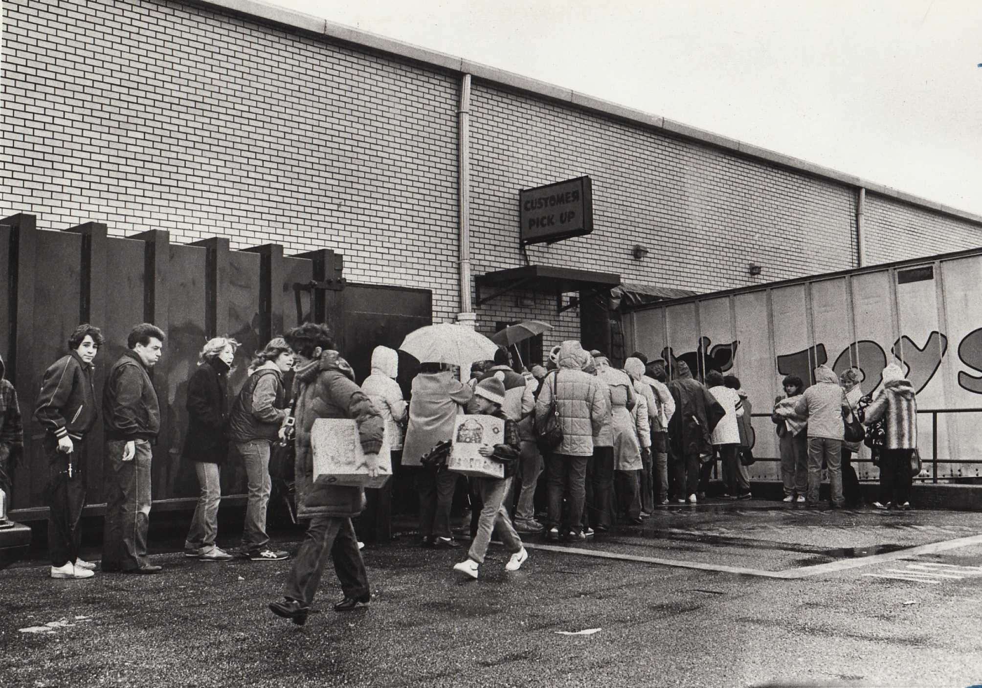 Shoppers wait three hours in the rain pick up rare Cabbage Patch Kids Dolls at the ToysRUs in 1983.