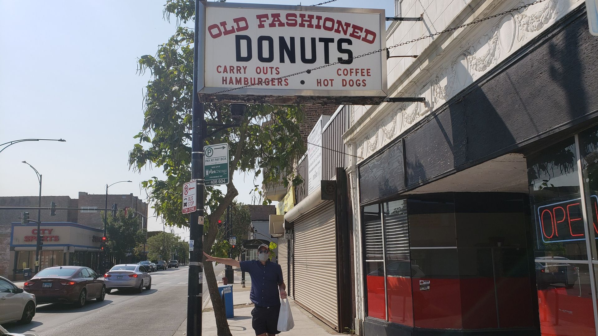 Justin stands in front of Old Fashioned Donuts in Roseland. 