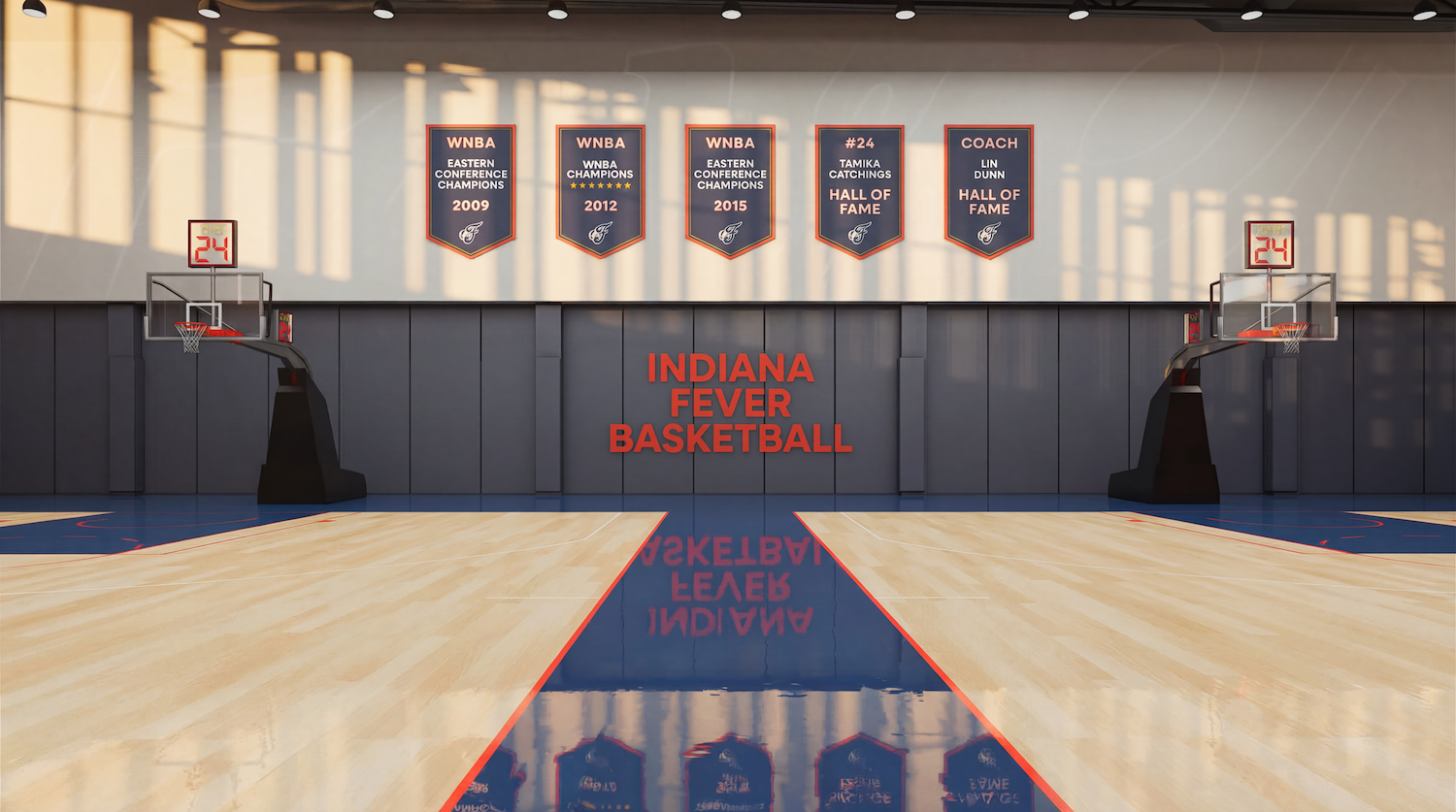Indoor basketball court with a glossy wooden floor and blue wall panels. A red "INDIANA FEVER BASKETBALL" sign on the back wall, with WNBA banners overhead and two hoops with 24-second clocks.