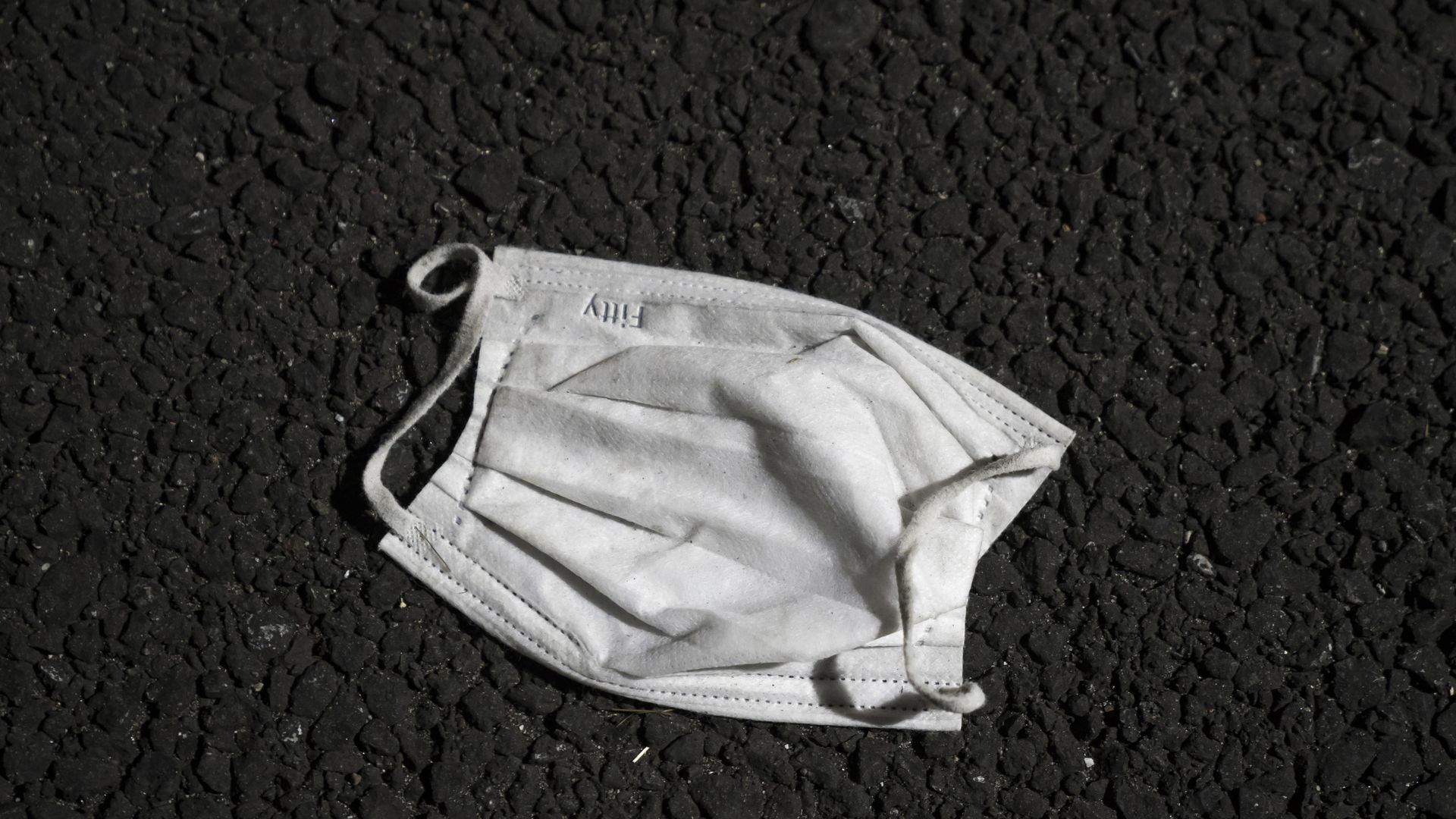 Face mask discarded on the ground outside the Diamond Princess cruise ship