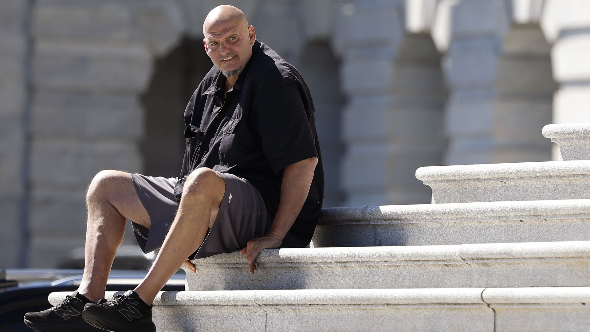 U.S. Sen. John Fetterman, D-PA, sitting on the steps of the U.S. Capitol.