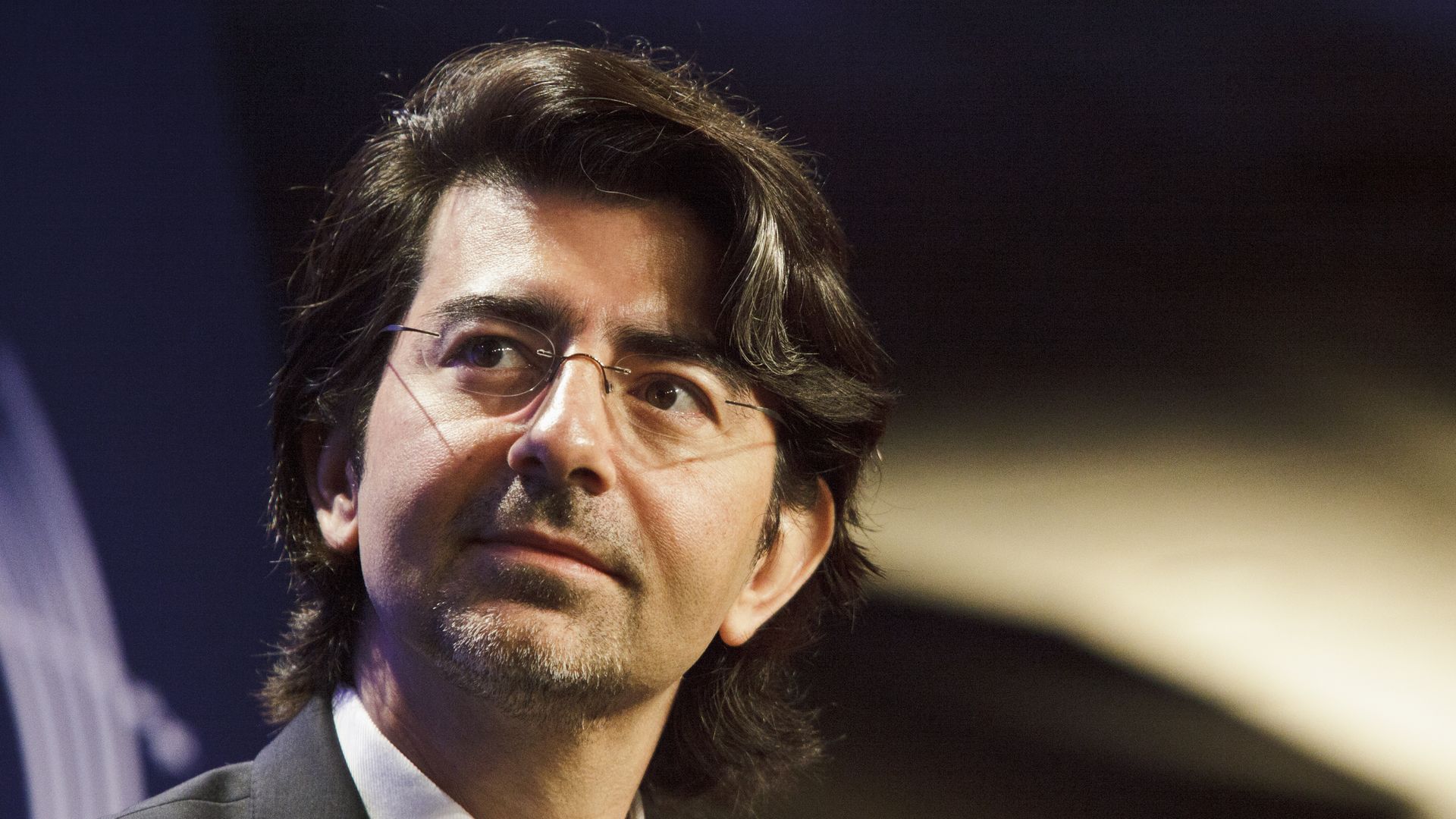 eBay founder Pierre Omidyar gazes into the distance