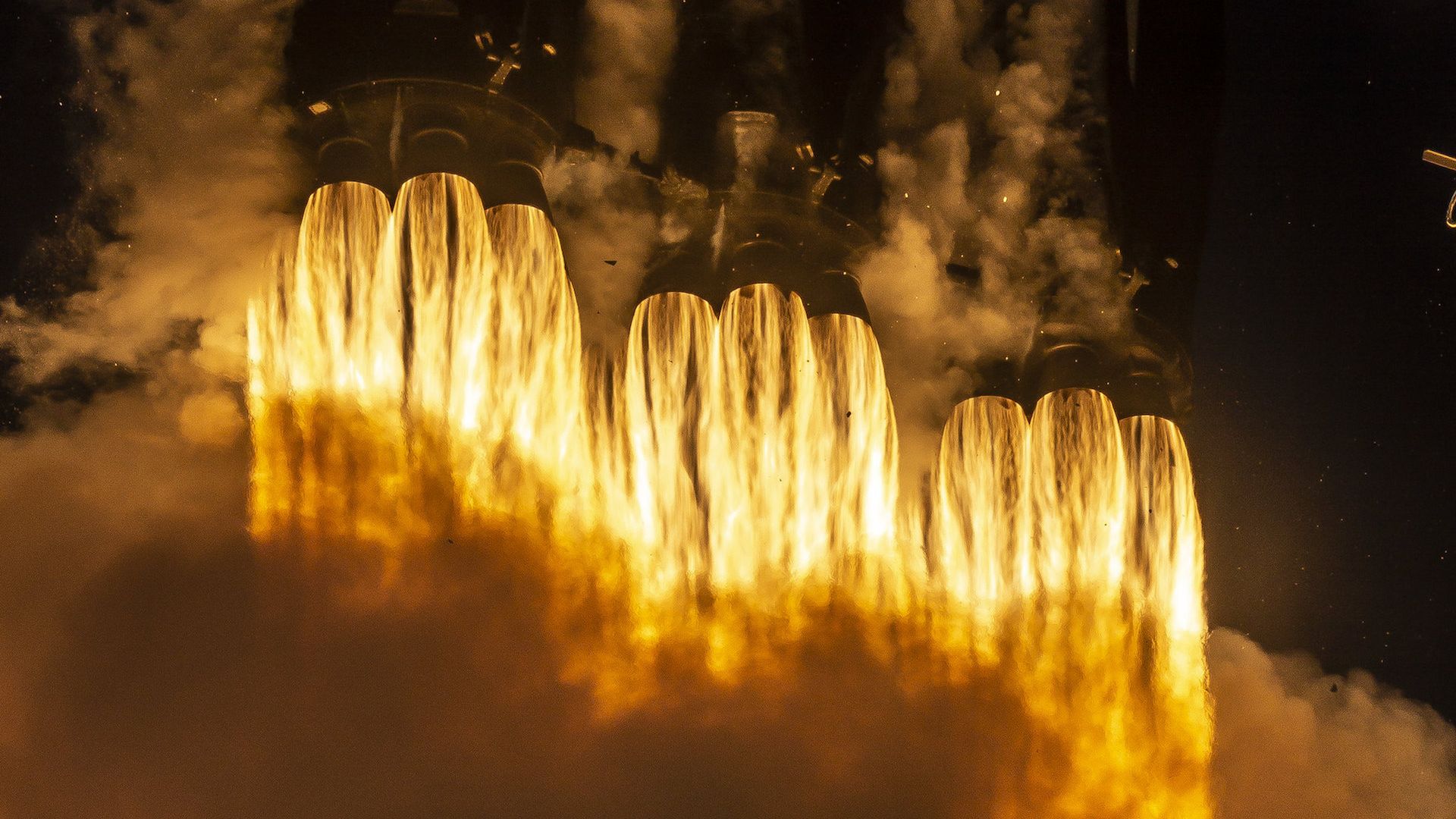 The engines of a Falcon Heavy ignite at launch.