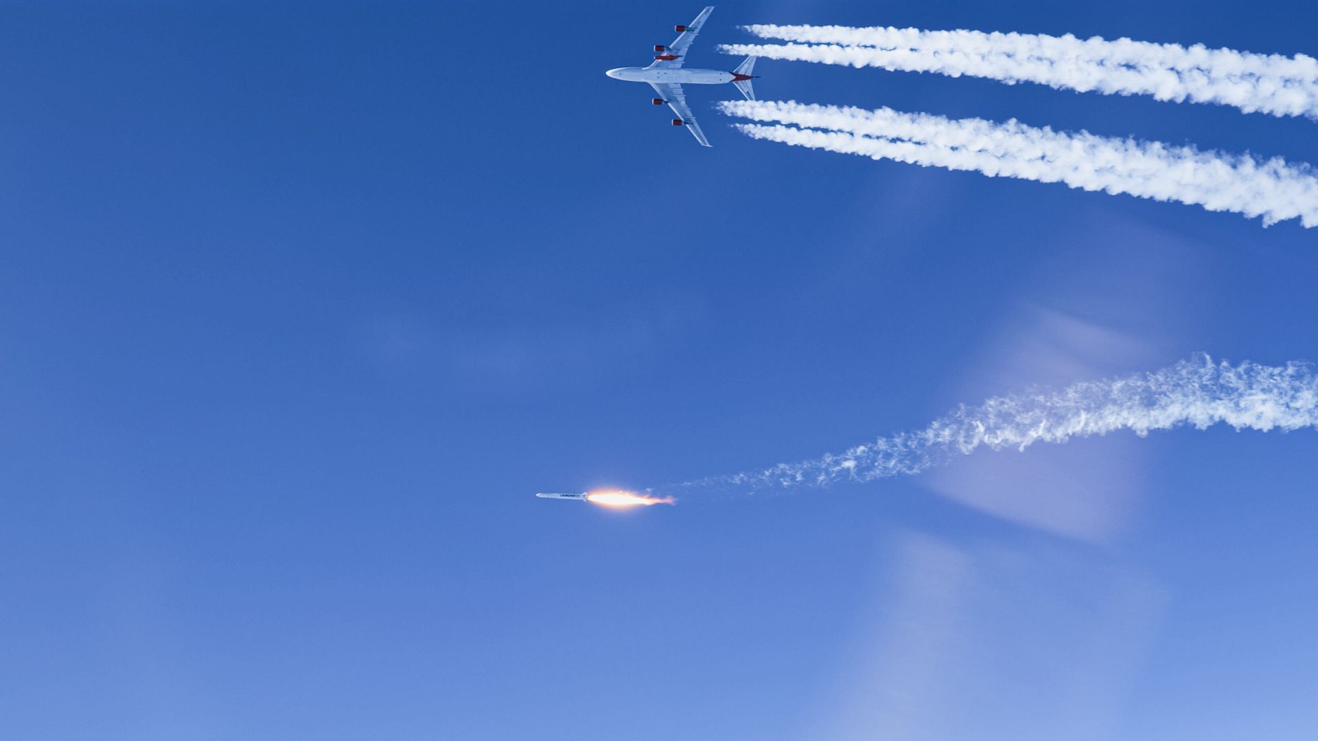 A rocket and a plane in the sky