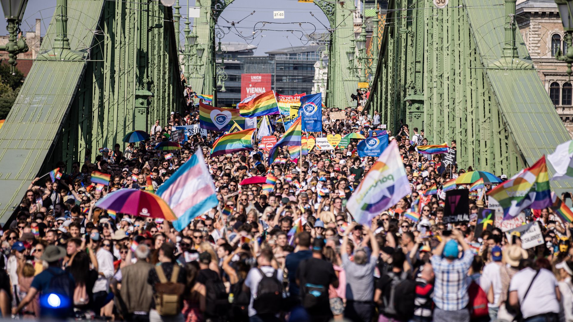 Demonstrators march on Liberty Bridge during the annual Pride parade in Budapest, Hungary, on Saturday, July 24, 2021.