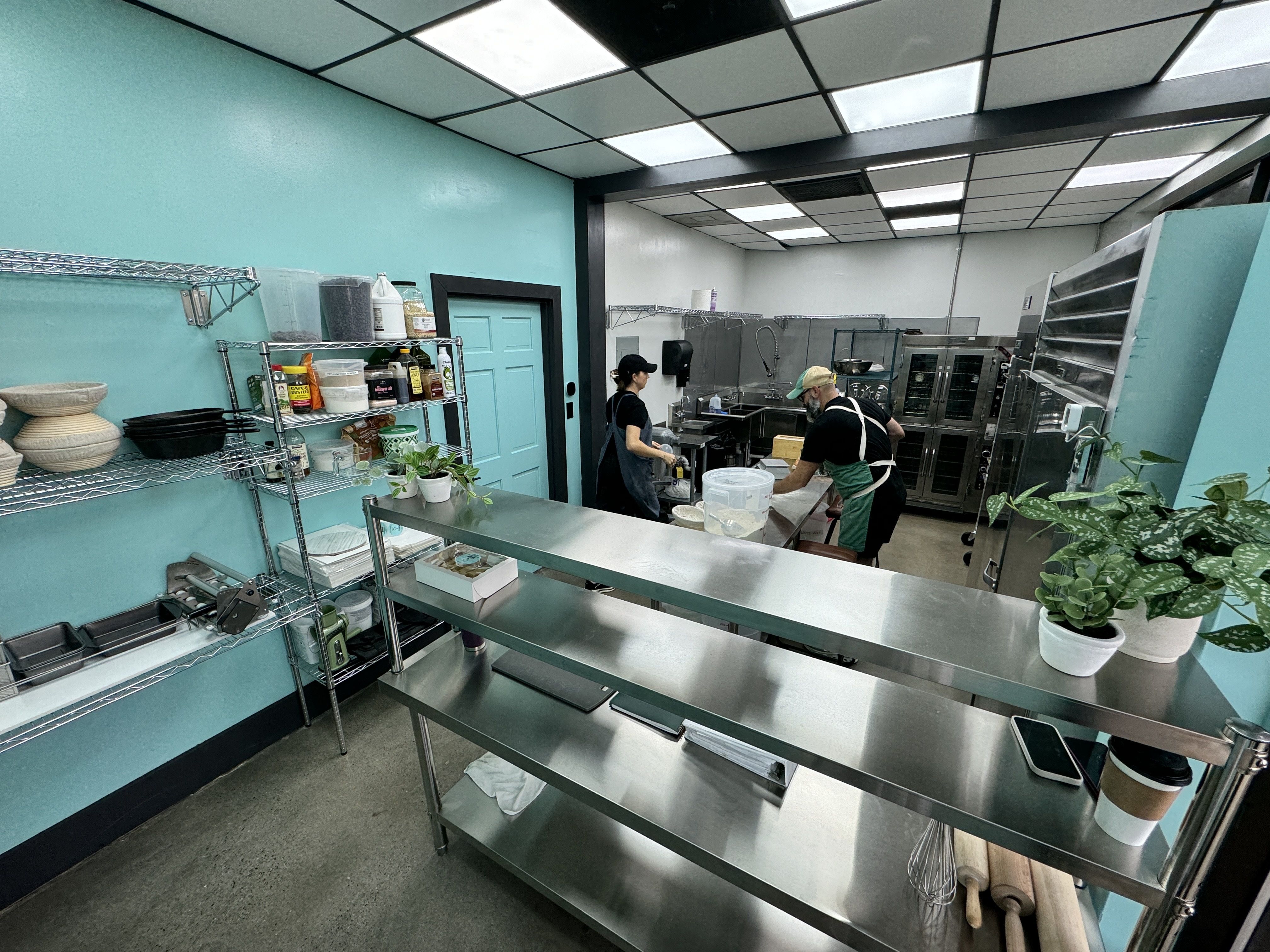 two people in a kitchen