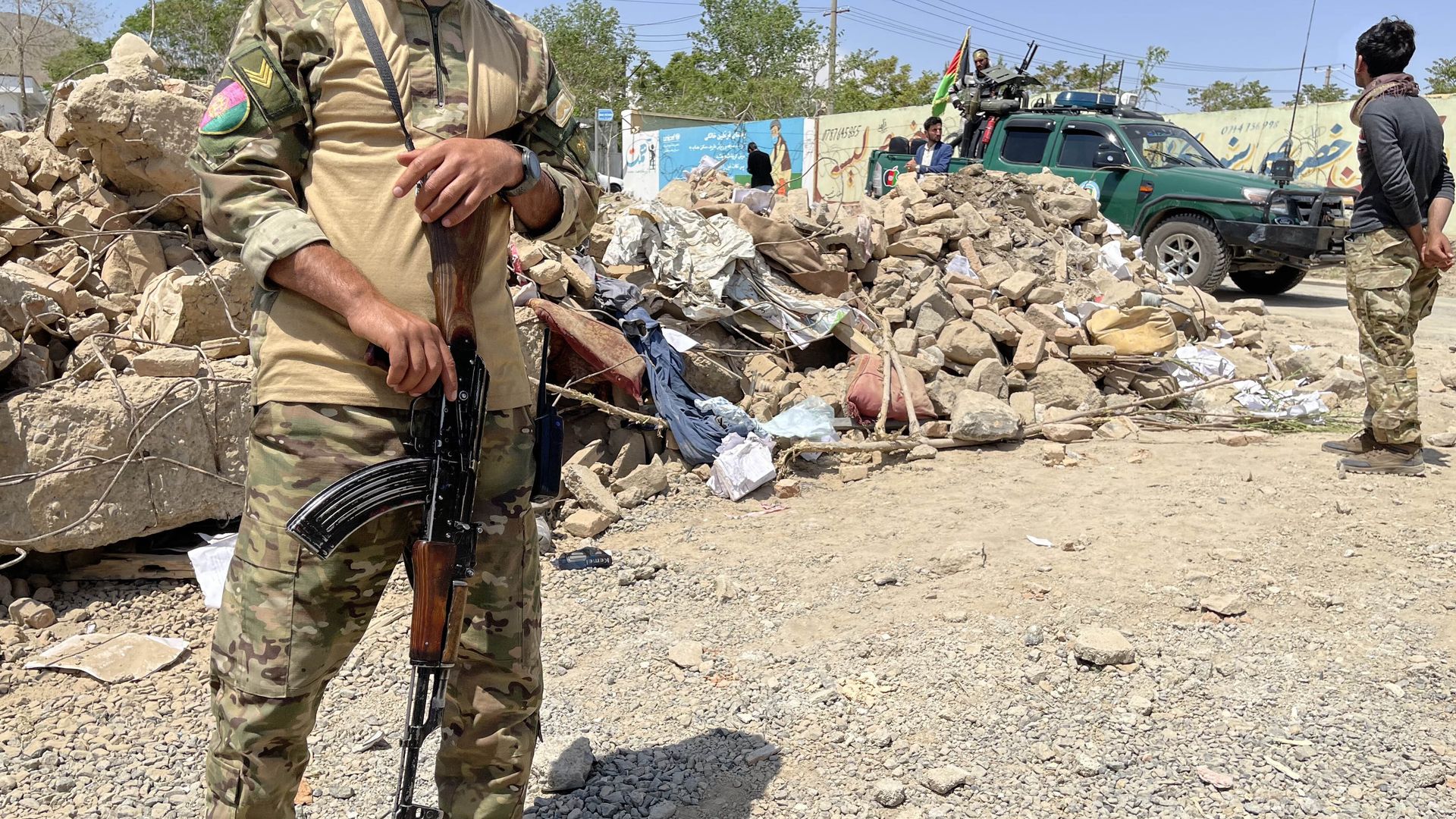  Afghanistan security personnel on May 1 inspecting the site of a vehicle bombing that killed at least 25 people  Logar Province, Afghanistan.