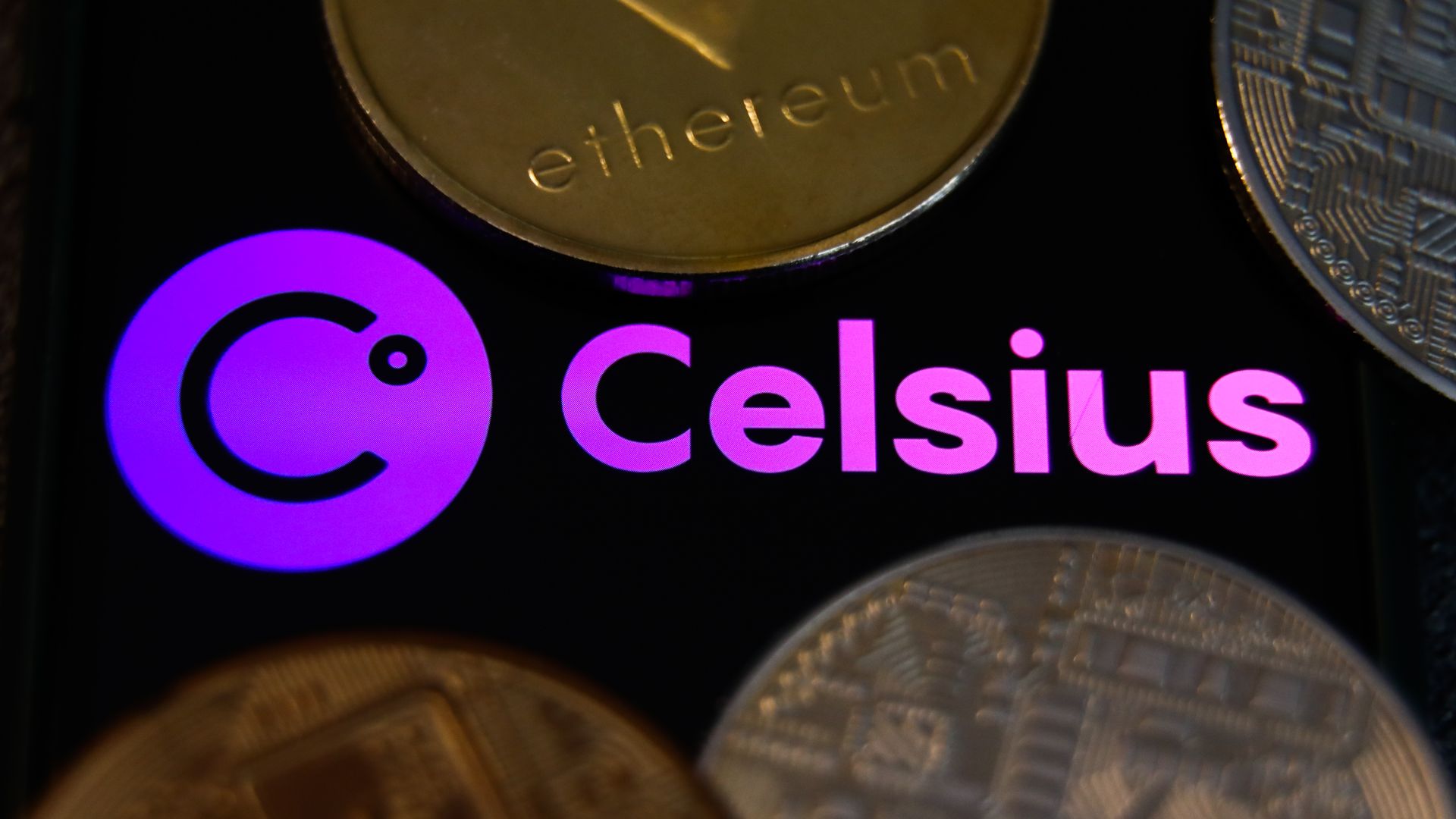 A photo illustration of the Celsius logo surrounded by physical coins.