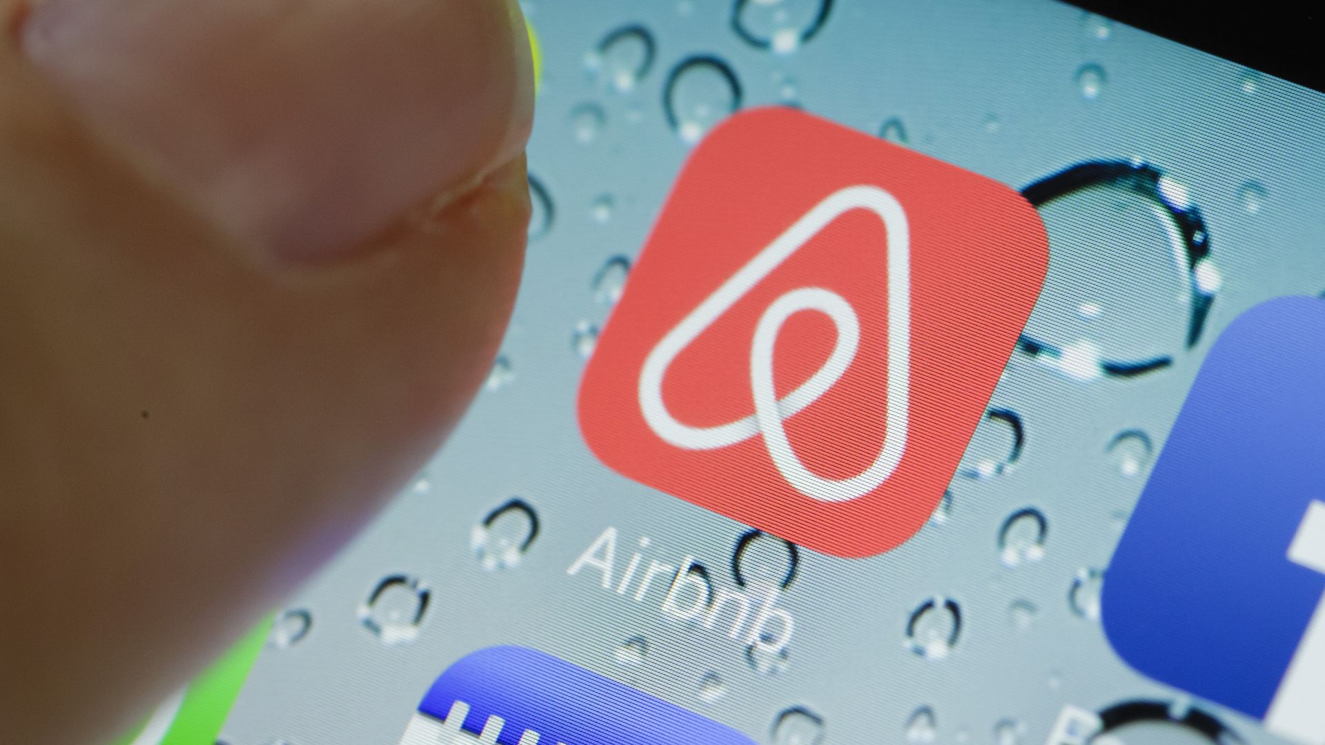 Photo of Airbnb mobile app icon. 