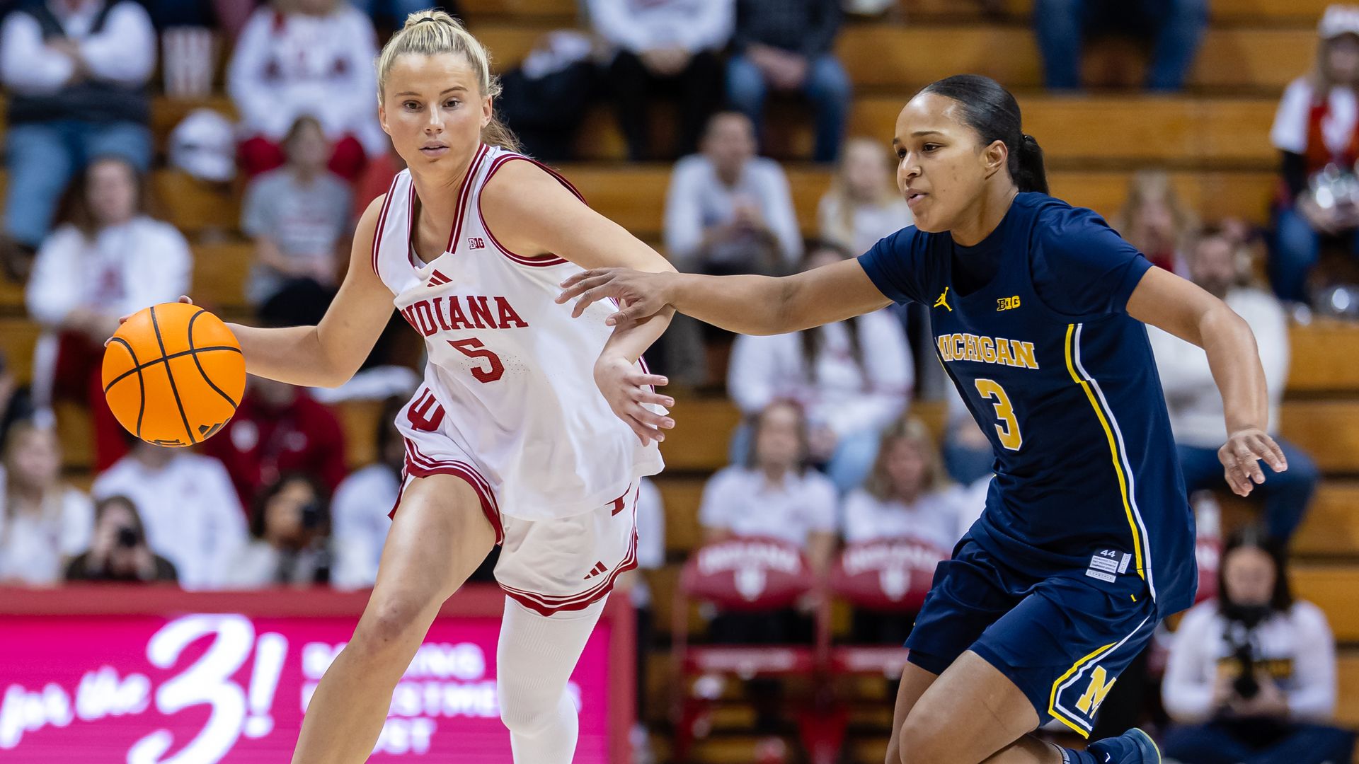 Lenée Beaumont #5 of the Indiana Hoosiers brings the ball up court against Mila Holloway #3 of the Michigan Wolverines at Simon Skjodt Assembly Hall on January 29, 2026 in Bloomington, Indiana. 