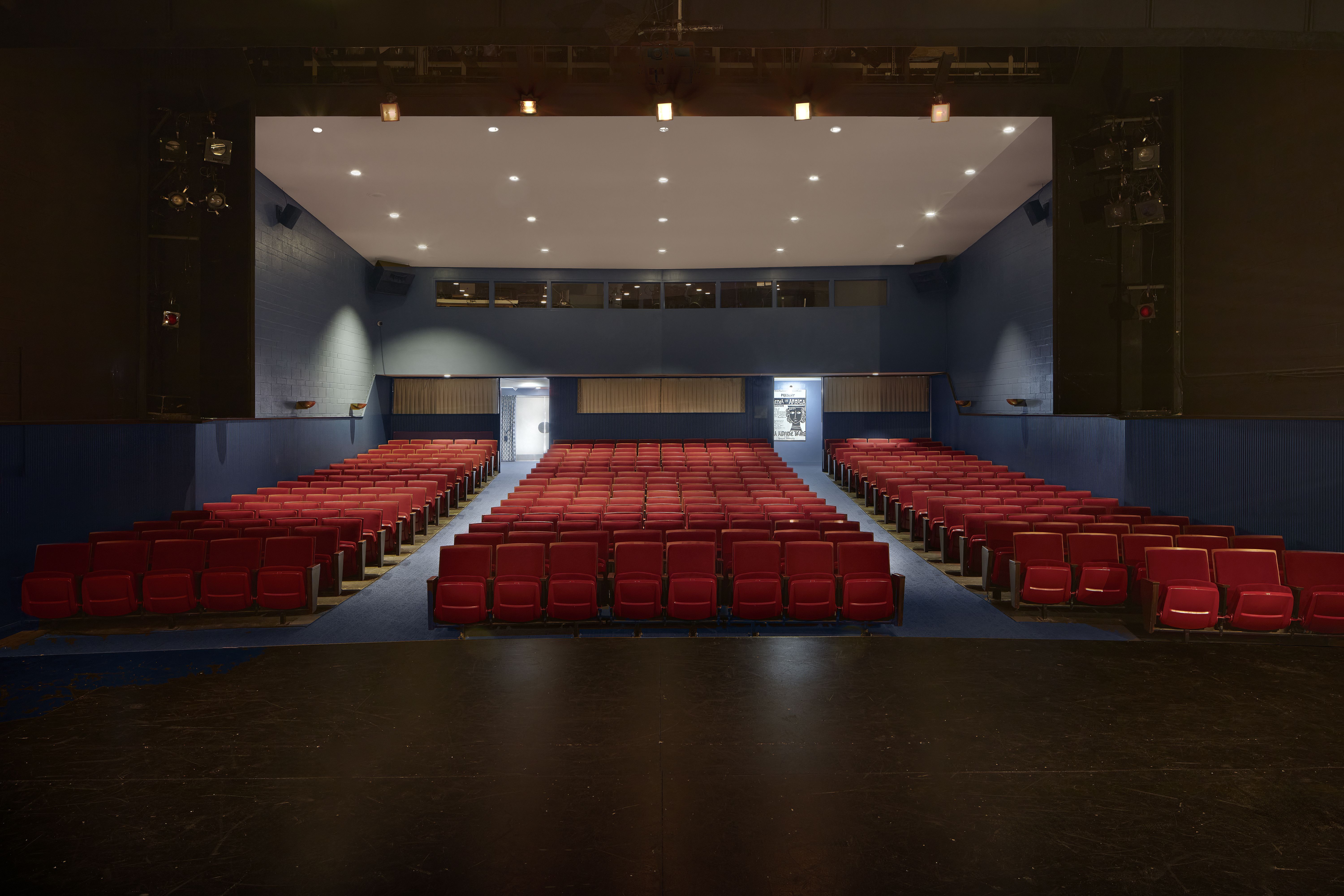 Inside the theater facing the seats