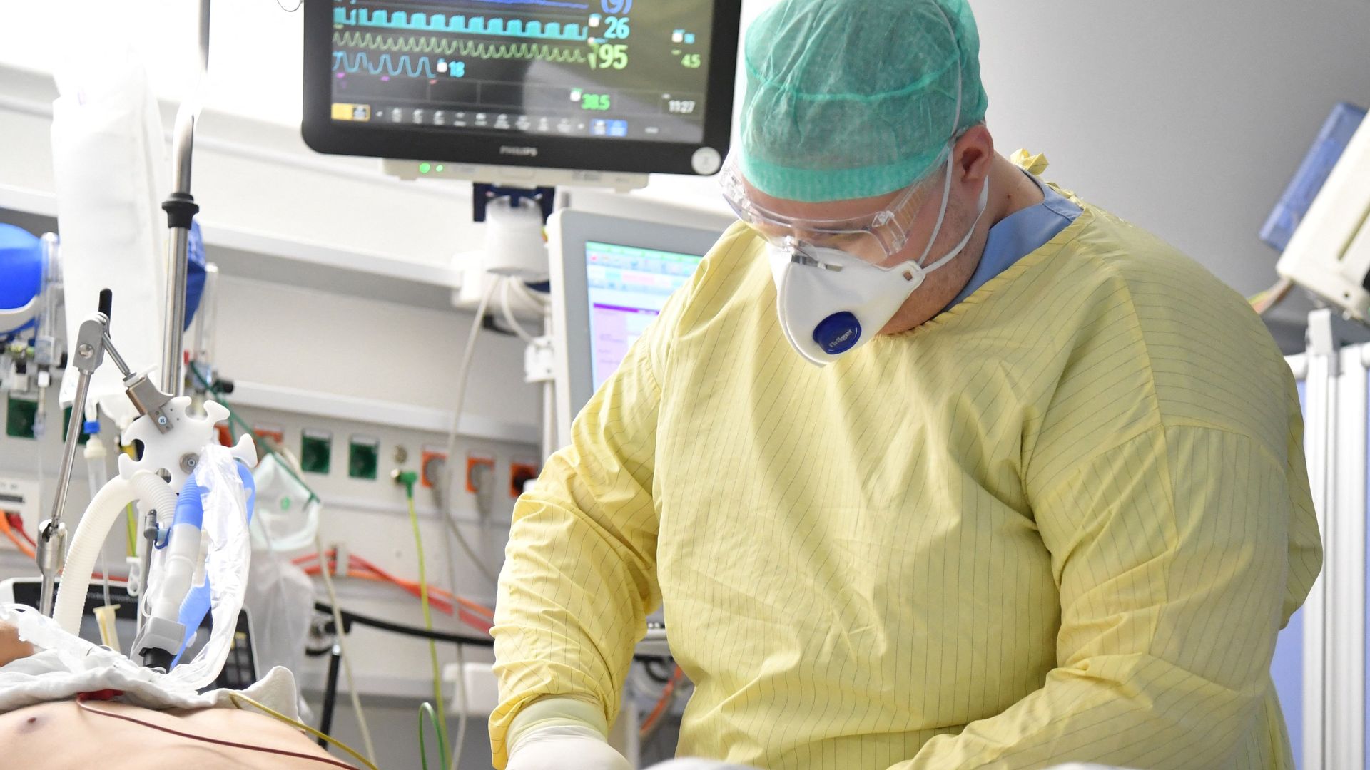 A health care worker tending to a COVID-19 patient in a hospital in Salzburg, Austria, on Nov. 17.