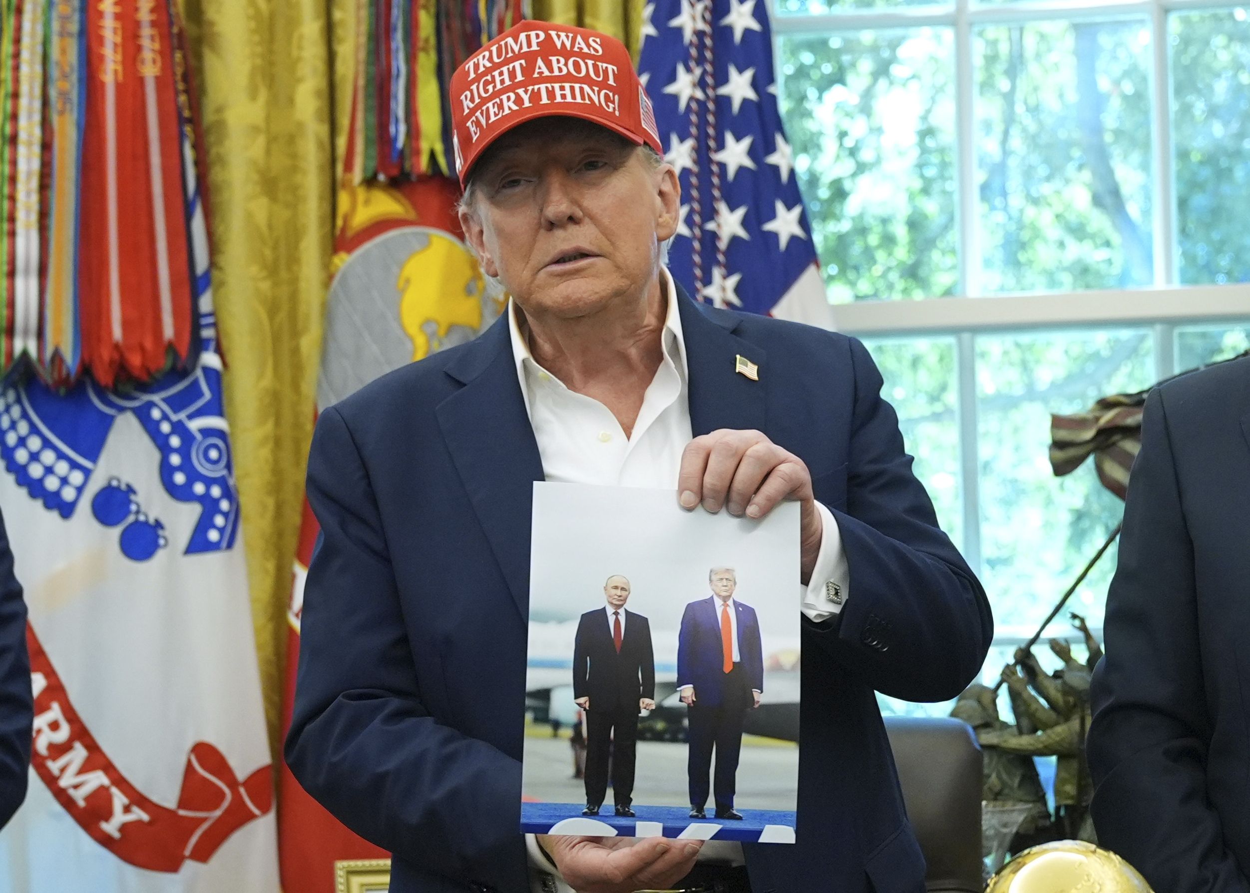 In the Oval Office last week, President Trump shows off a photo he says was sent to him by Russian President Vladimir Putin. 