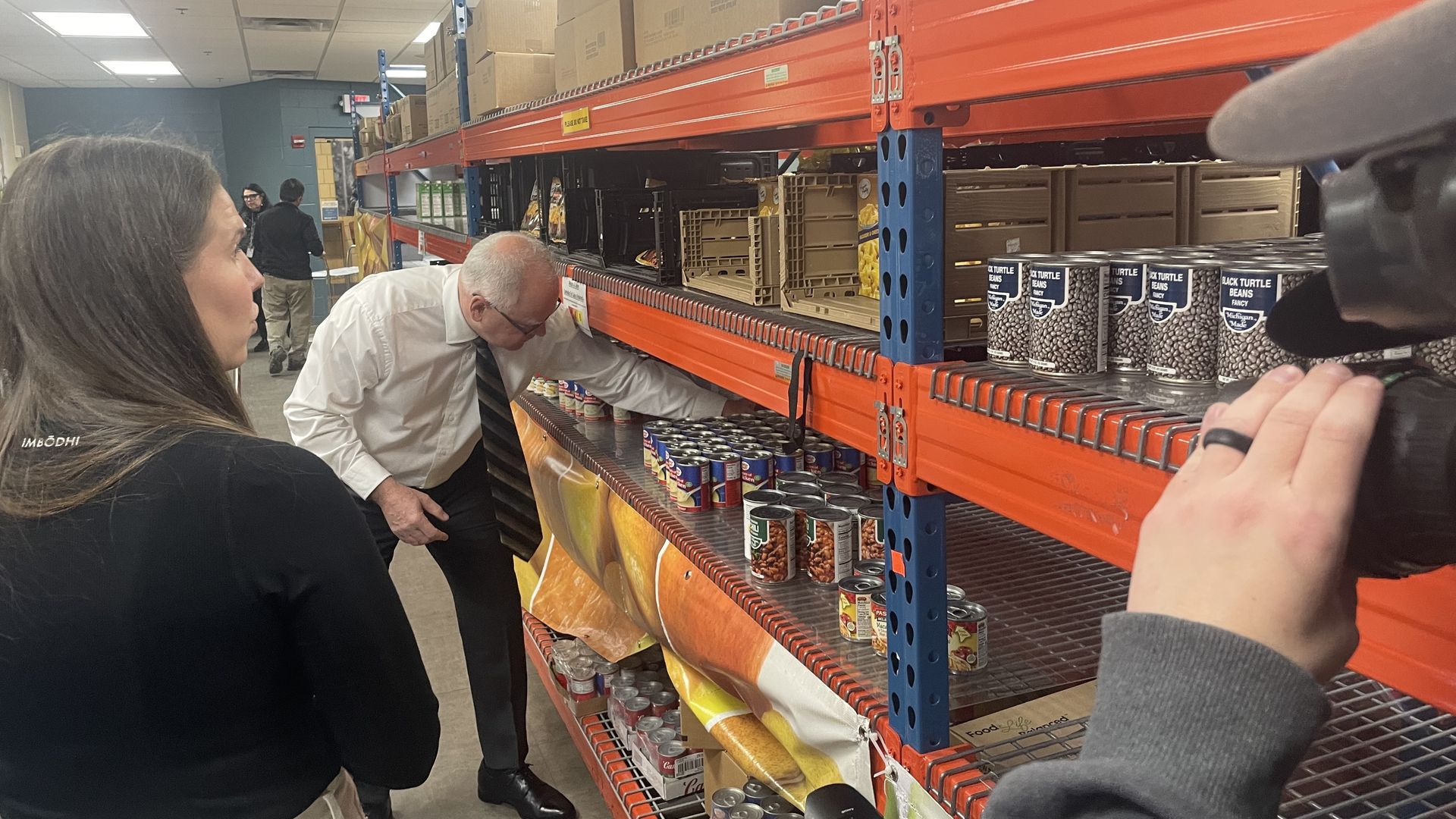 Gov. Tim Walz stocking shelves