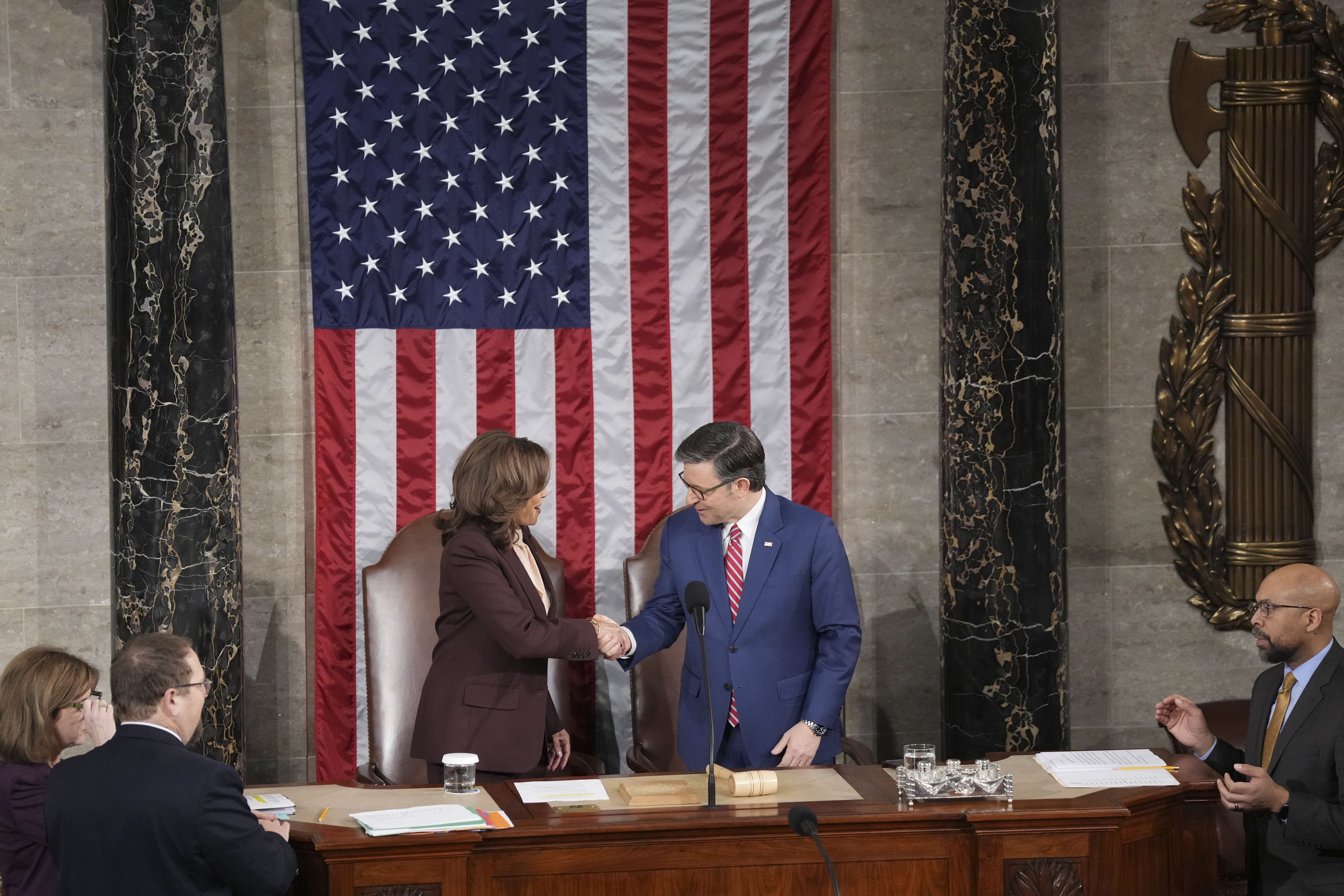 Vice President Kamala Harris greets House Speaker Mike Johnson (R-La.) before a joint session of Congress to certify President-elect Donald Trump's victory at the Capitol in Washington, on Monday, Jan. 6, 2025. (Eric Lee/The New York Times)